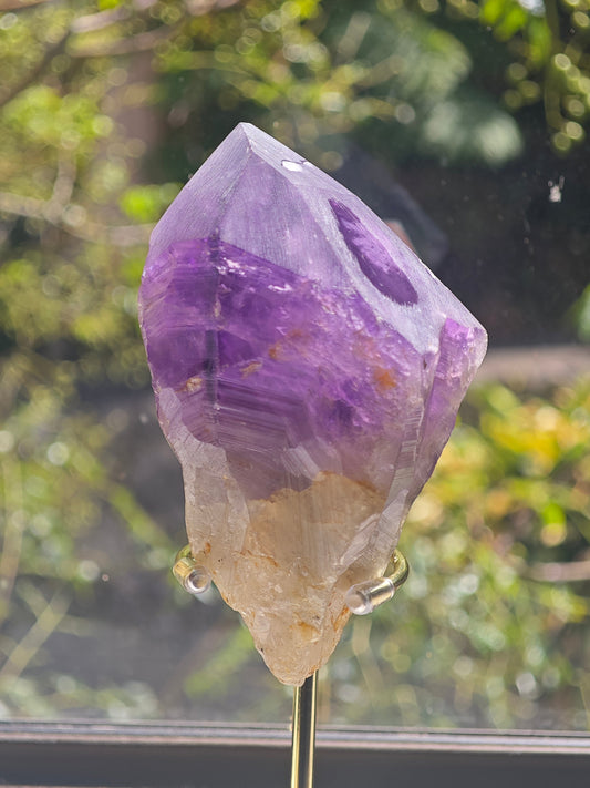 Natural raw Brazilian Amethyst point with purple crystal faces
