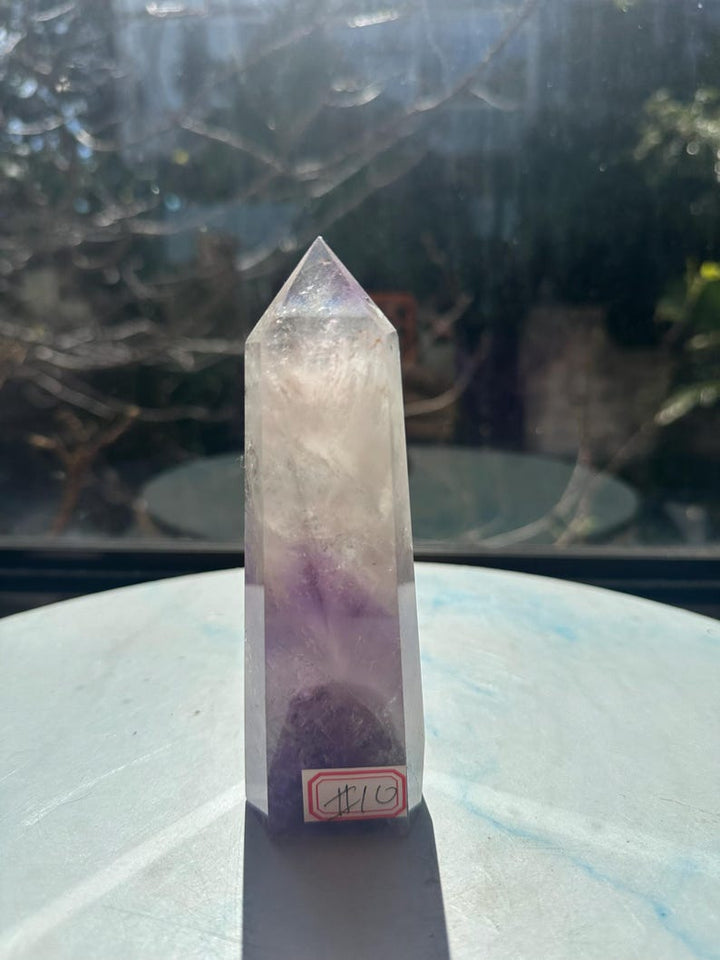 Phantom Amethyst tower exact piece 10 with purple lower areas, a pale cloudy upper section and a polished point