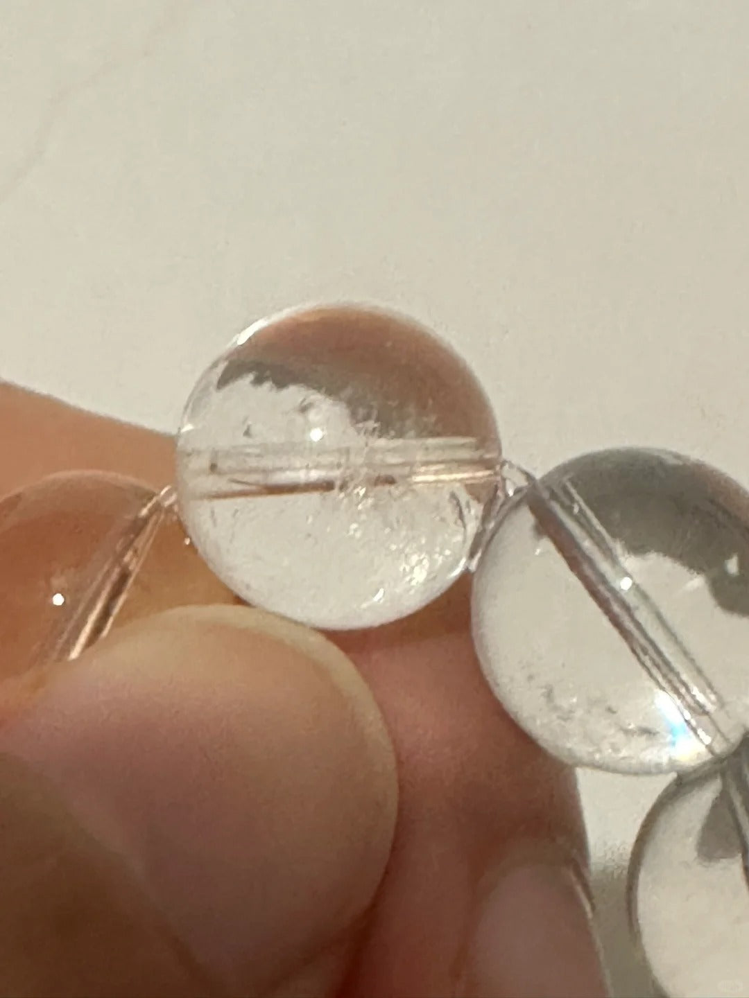 Clear Quartz bracelet detail showing polished round crystal beads