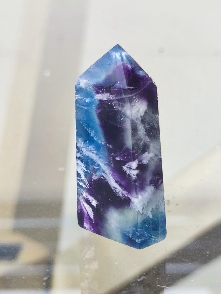 Embrace the Rainbow: Mesmerizing Feather Fluorite Tower Point Generator