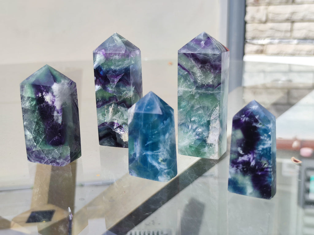 Embrace the Rainbow: Mesmerizing Feather Fluorite Tower Point Generator