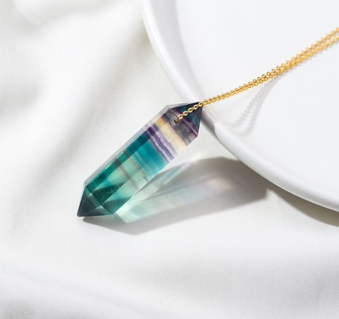 Rainbow fluorite necklace pendant close-up with natural colour variation