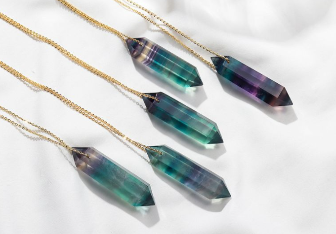 Rainbow fluorite hexagonal point necklace showing green and purple bands