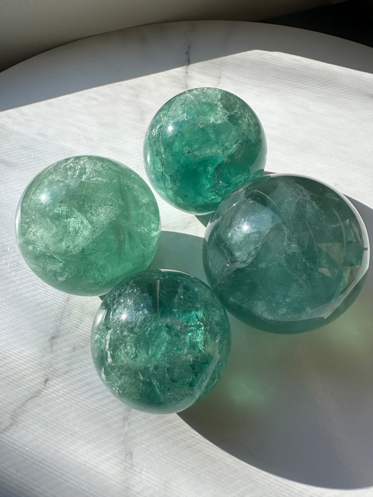 Natural Green Fluorite sphere 4.5–6.5cm with translucent colour zoning