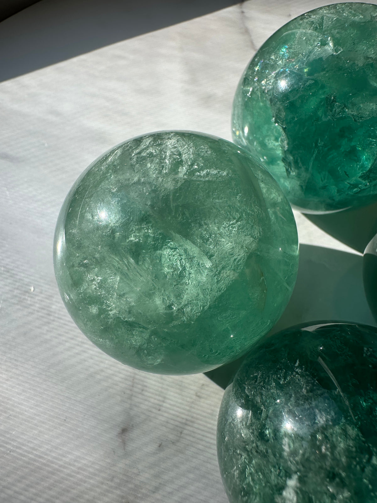 Green Fluorite crystal ball alternate view showing natural green bands