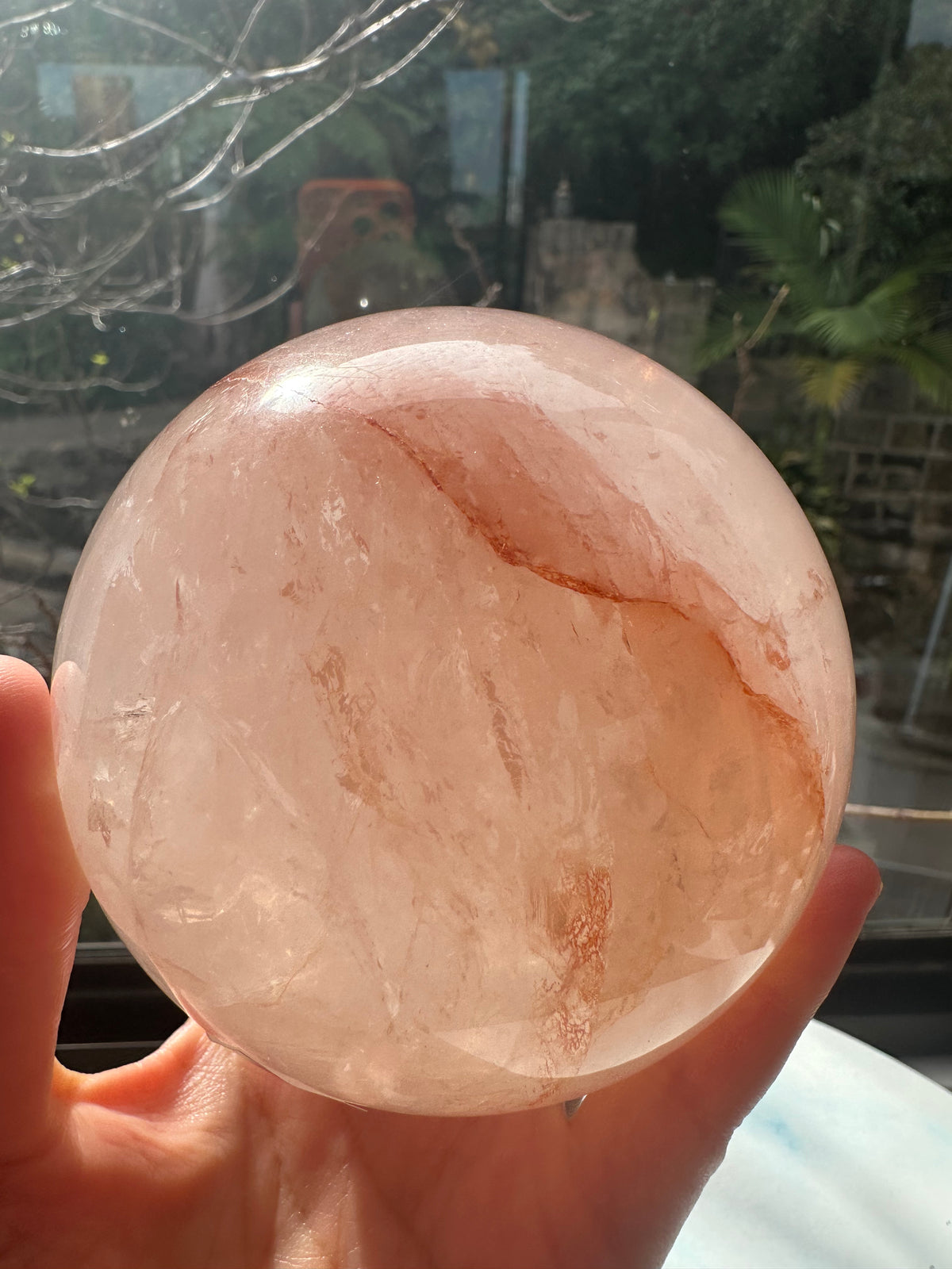 Fire Quartz sphere #1 showing red hematite inclusions and internal quartz veils, alternate view 10