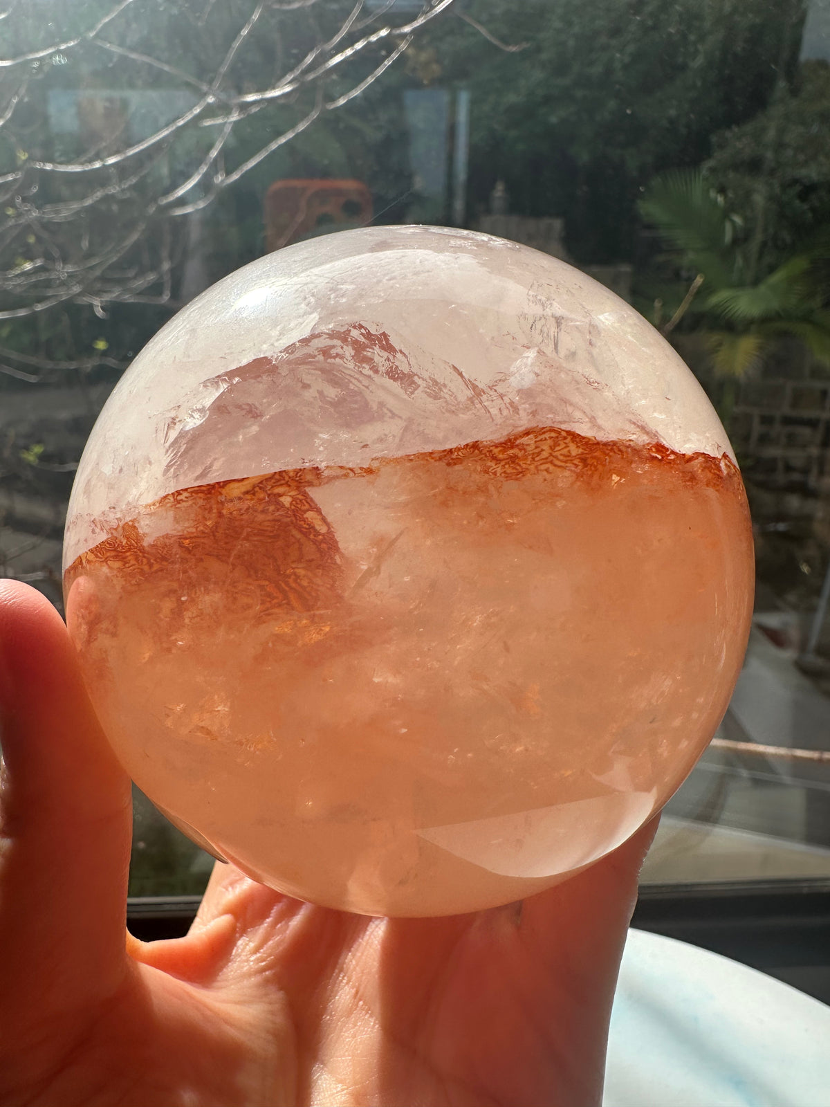Fire Quartz sphere #1 showing red hematite inclusions and internal quartz veils, alternate view 12