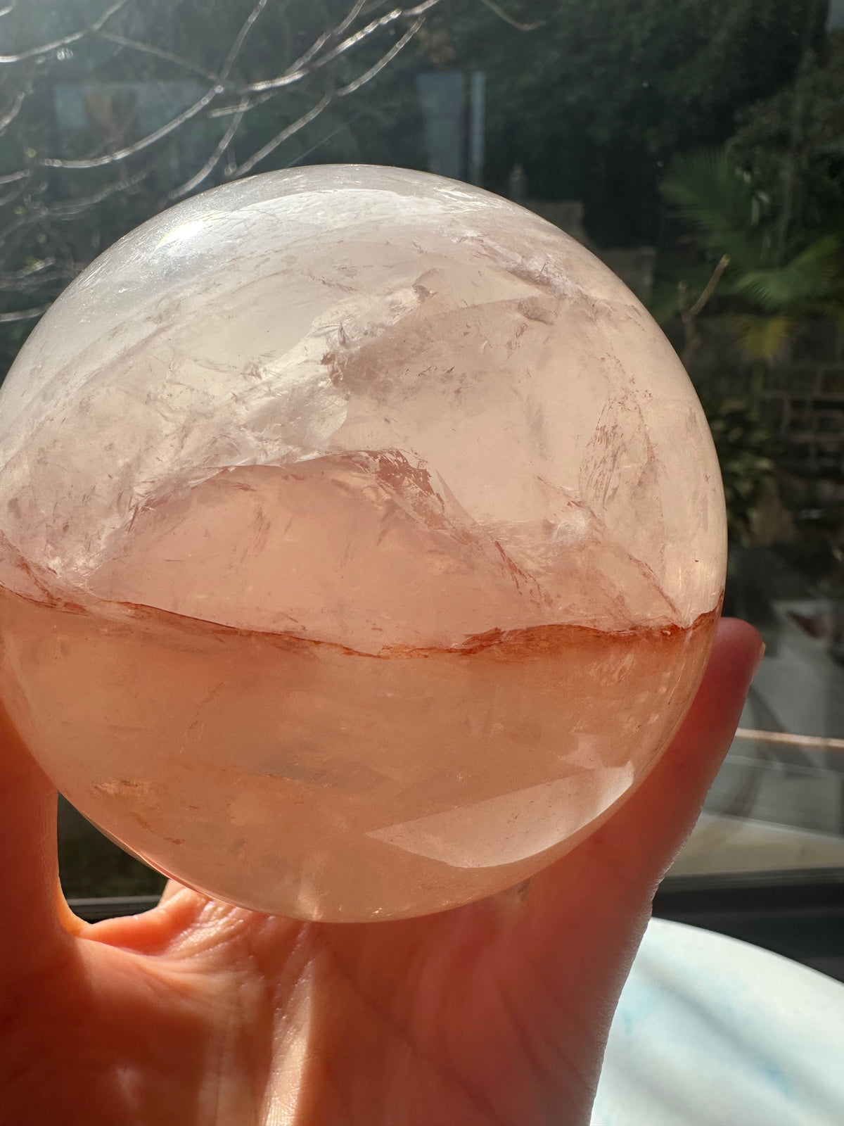 Fire Quartz sphere #1 showing red hematite inclusions and internal quartz veils, alternate view 13