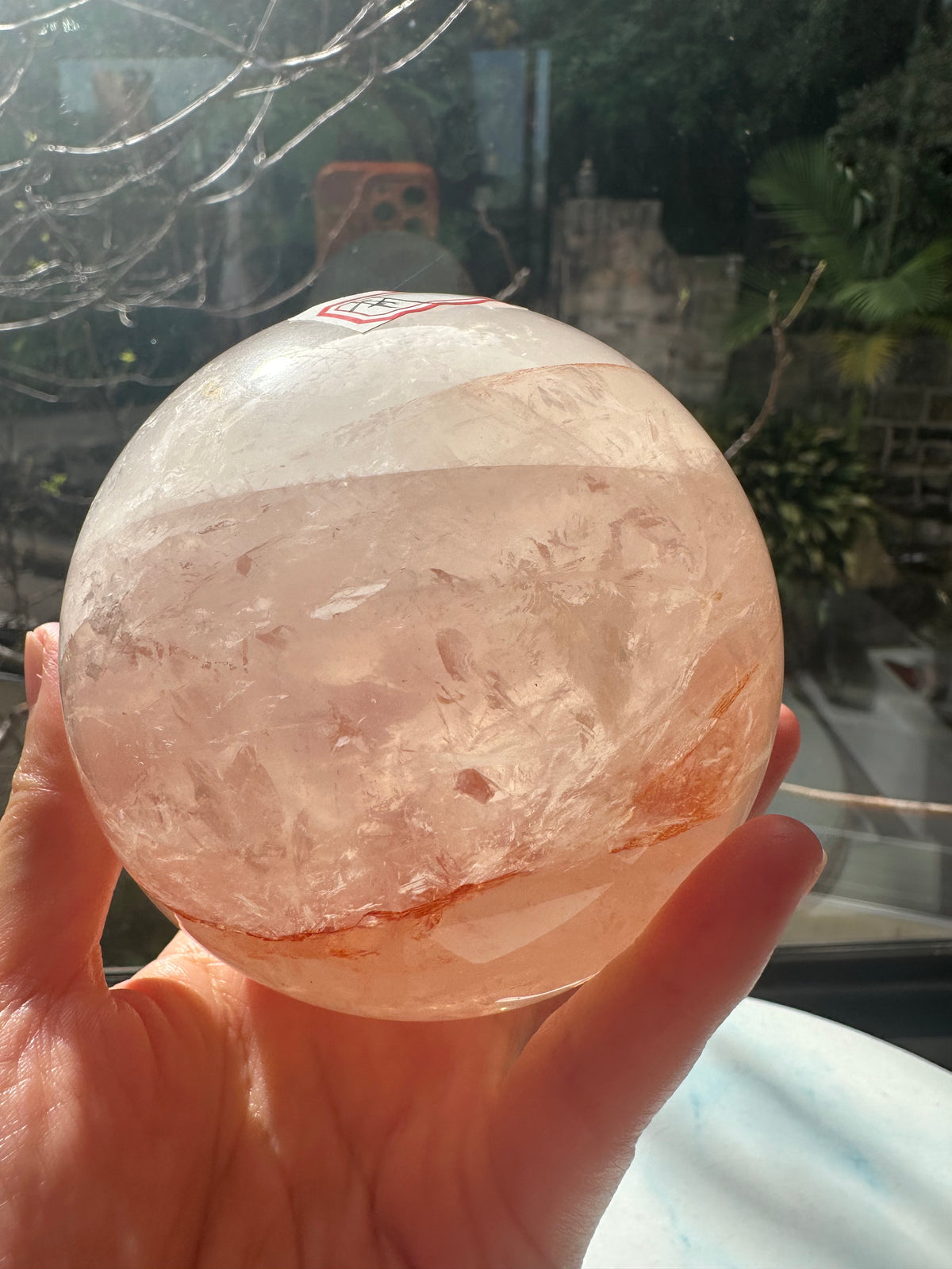 Fire Quartz sphere #1 showing red hematite inclusions and internal quartz veils, alternate view 14