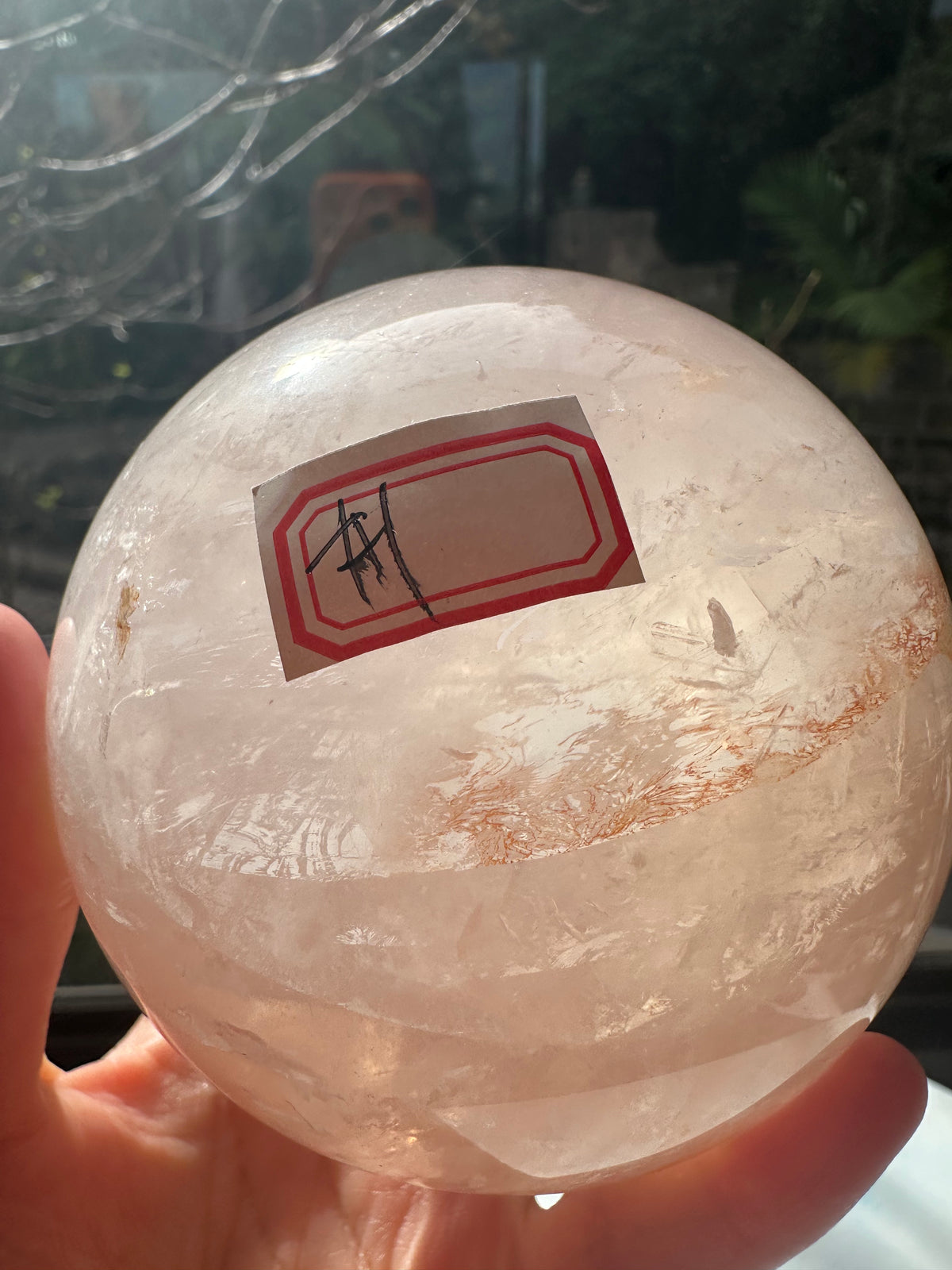 Fire Quartz sphere #1 showing red hematite inclusions and internal quartz veils, alternate view 15
