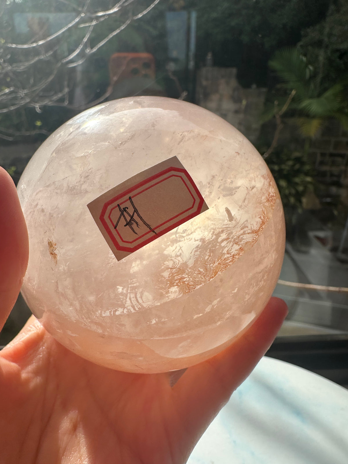 Fire Quartz sphere #1 showing red hematite inclusions and internal quartz veils, alternate view 16