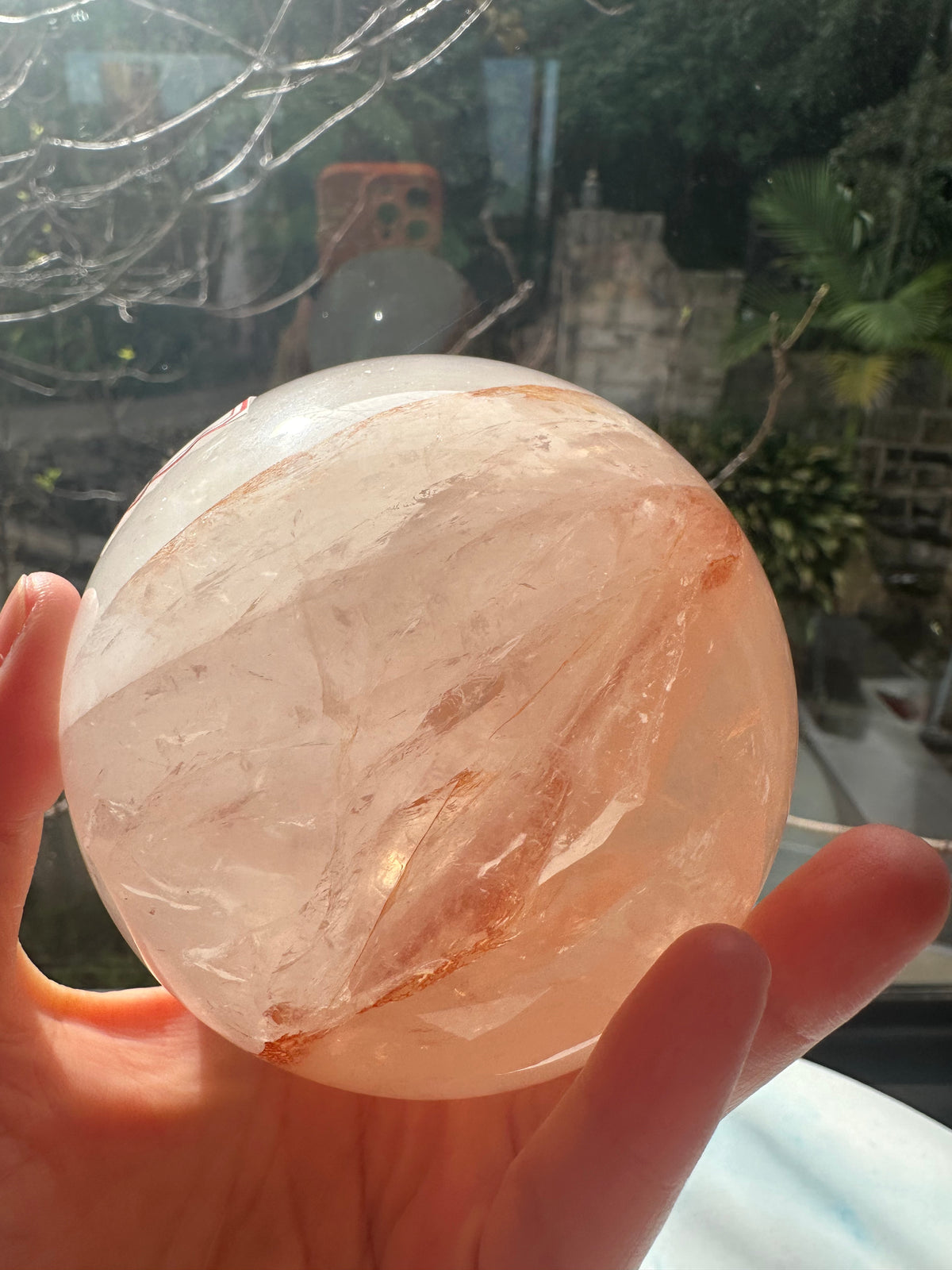 Fire Quartz sphere #1 showing red hematite inclusions and internal quartz veils, alternate view 17
