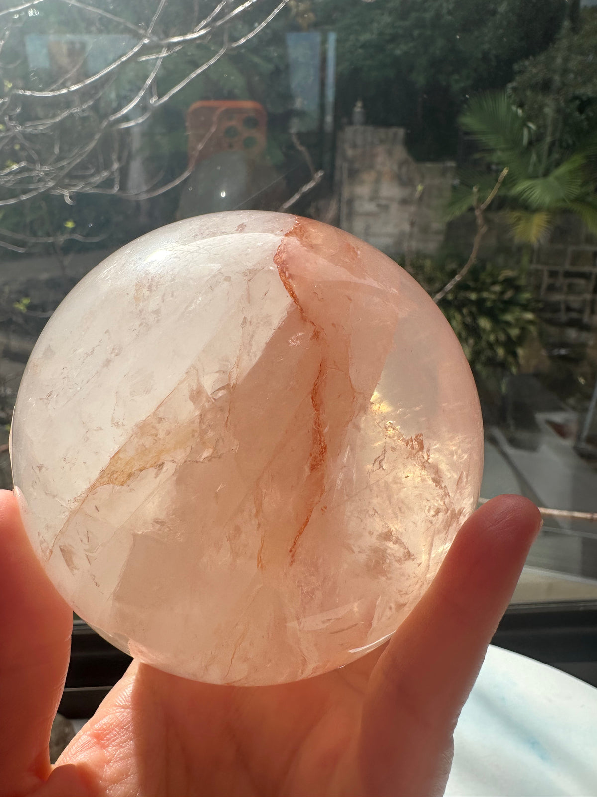 Fire Quartz sphere #1 showing red hematite inclusions and internal quartz veils, alternate view 19