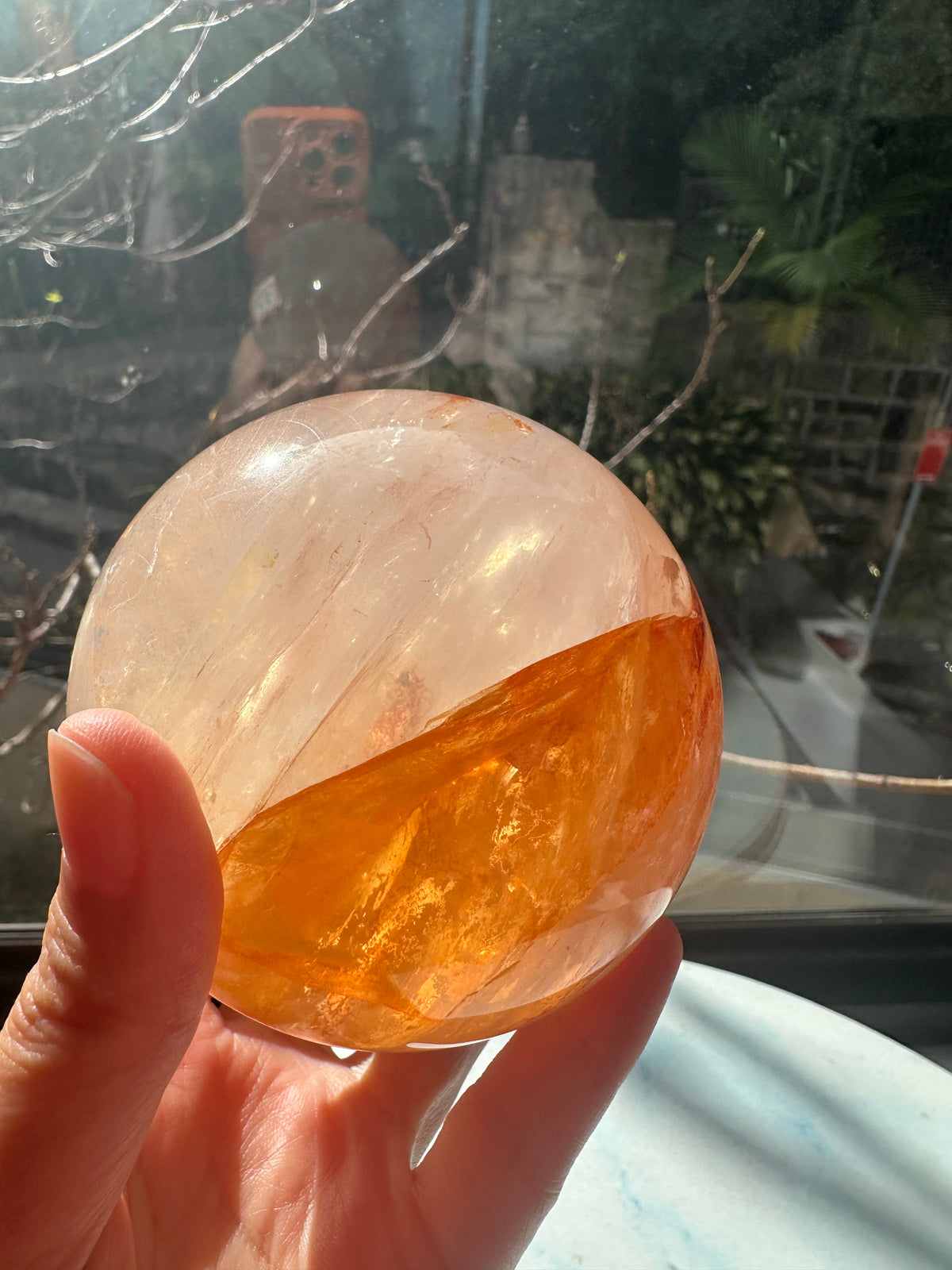Fire Quartz sphere #2 showing red hematite inclusions and internal quartz veils, alternate view 6