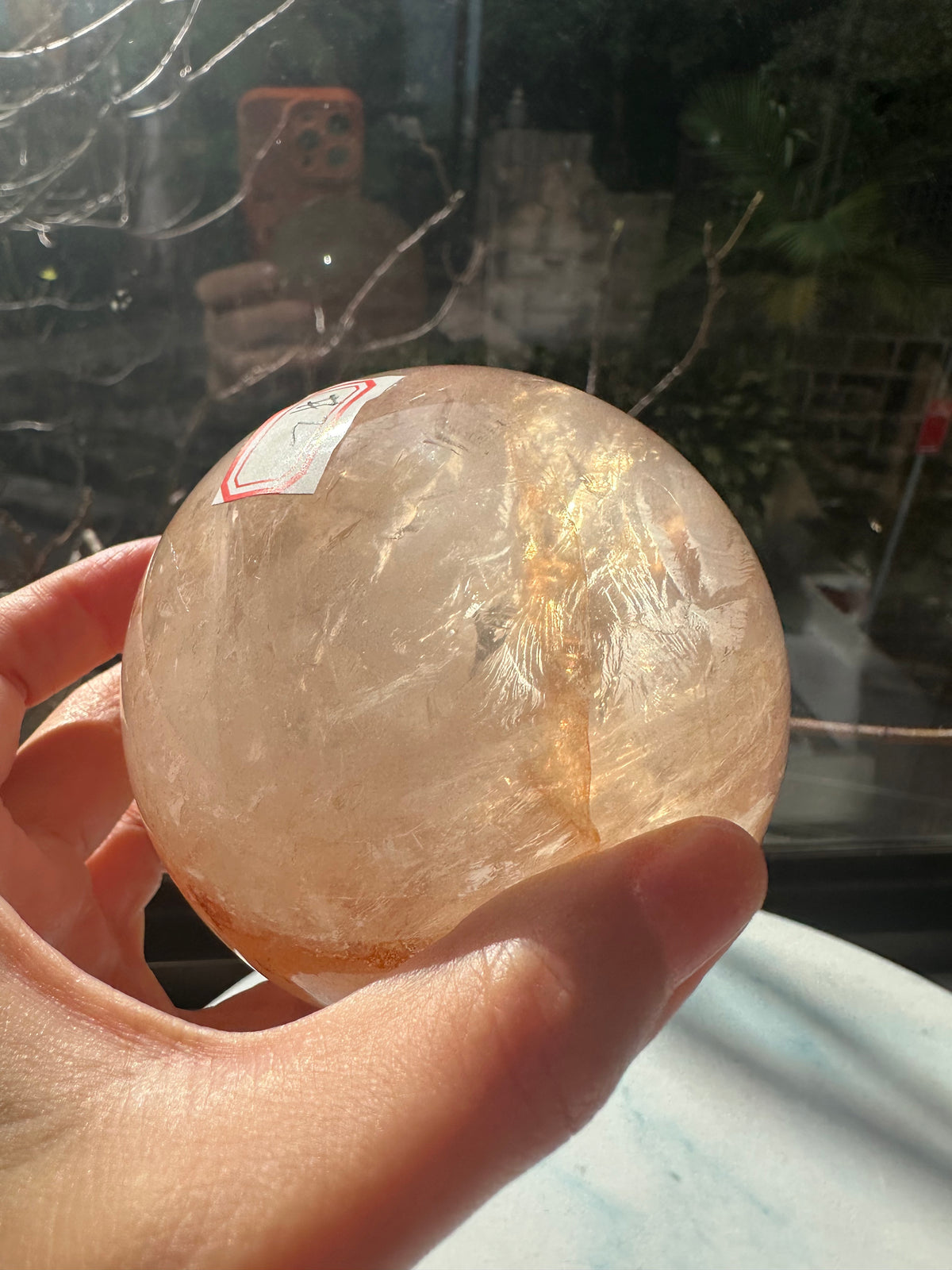 Fire Quartz sphere #2 showing red hematite inclusions and internal quartz veils, alternate view 8