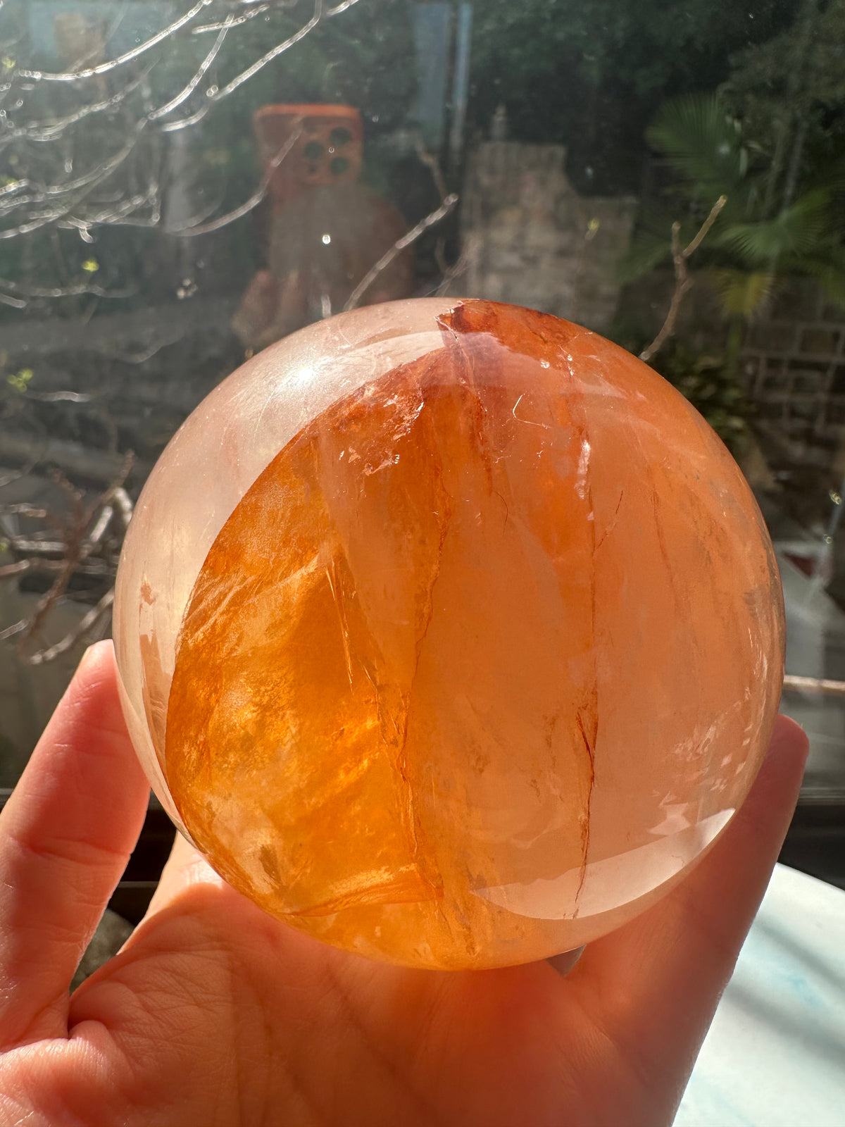 Fire Quartz sphere #2 showing red hematite inclusions and internal quartz veils, alternate view 9