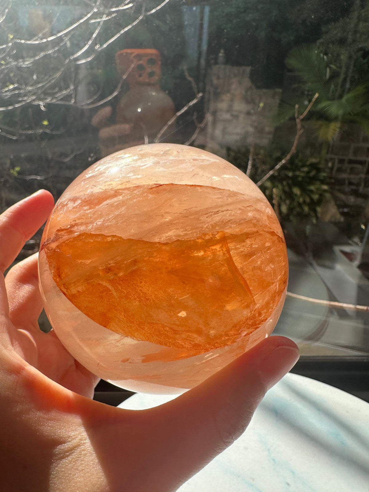 Fire Quartz sphere #2 showing red hematite inclusions and internal quartz veils, alternate view 11
