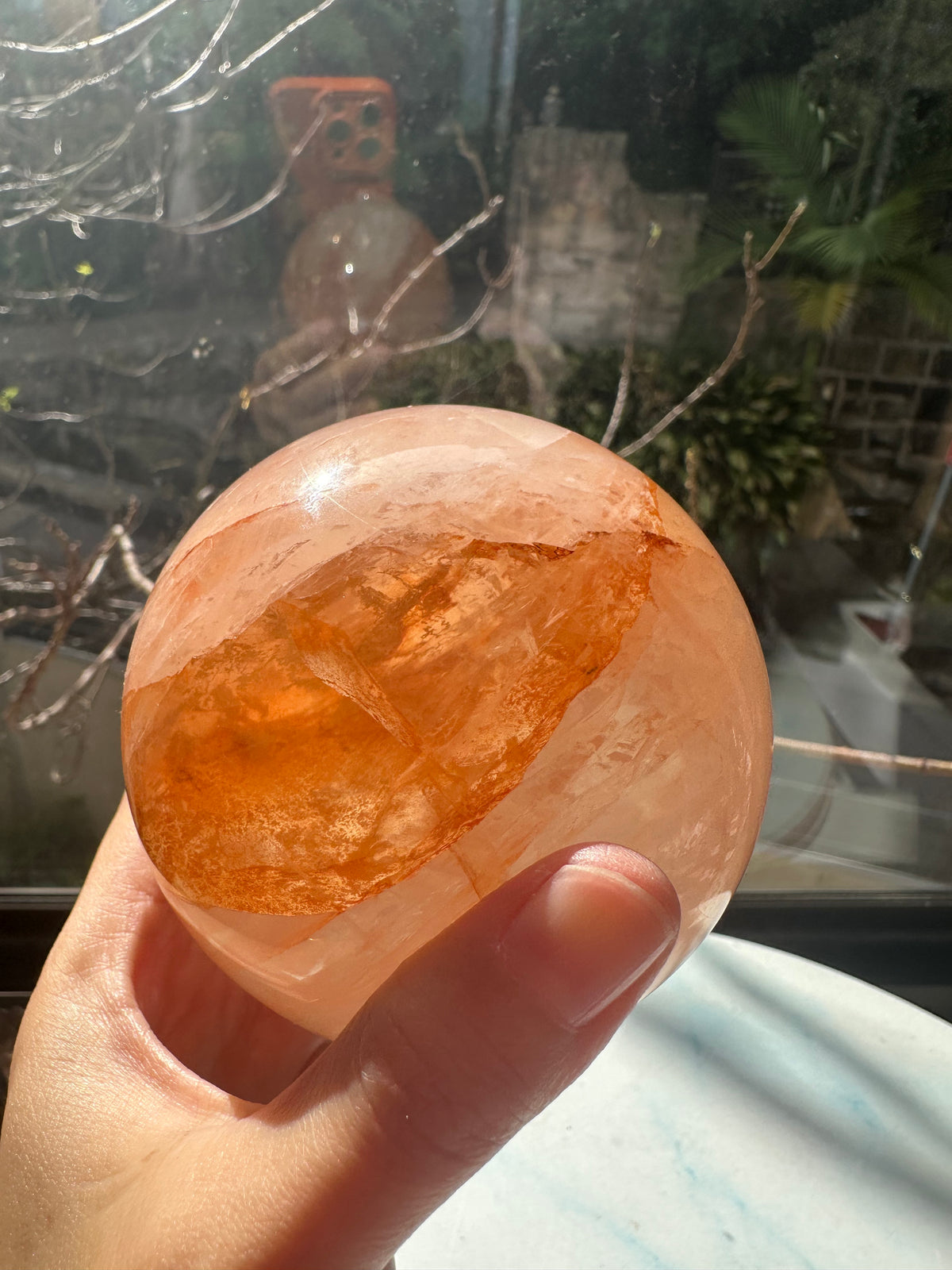 Fire Quartz sphere #2 showing red hematite inclusions and internal quartz veils, alternate view 12