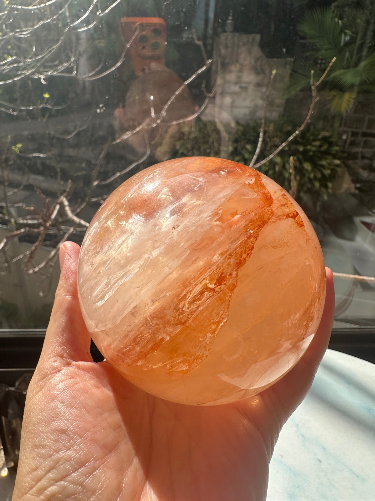 Fire Quartz sphere #2 showing red hematite inclusions and internal quartz veils, alternate view 14