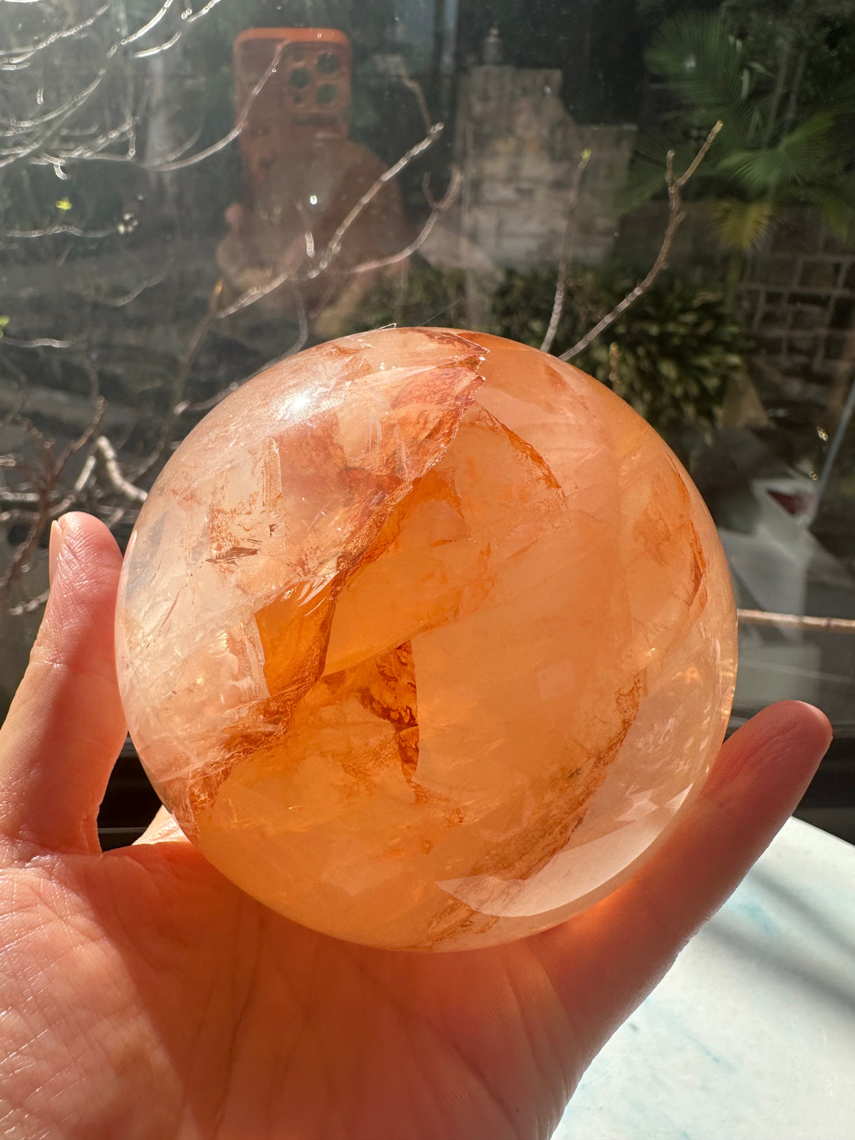 Fire Quartz sphere #2 showing red hematite inclusions and internal quartz veils, alternate view 15
