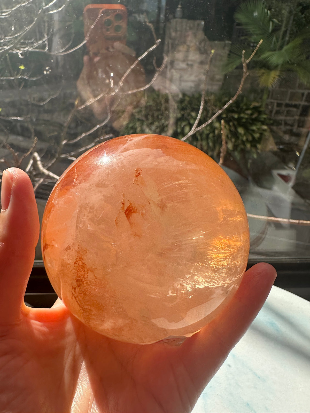 Fire Quartz sphere #2 showing red hematite inclusions and internal quartz veils, alternate view 16