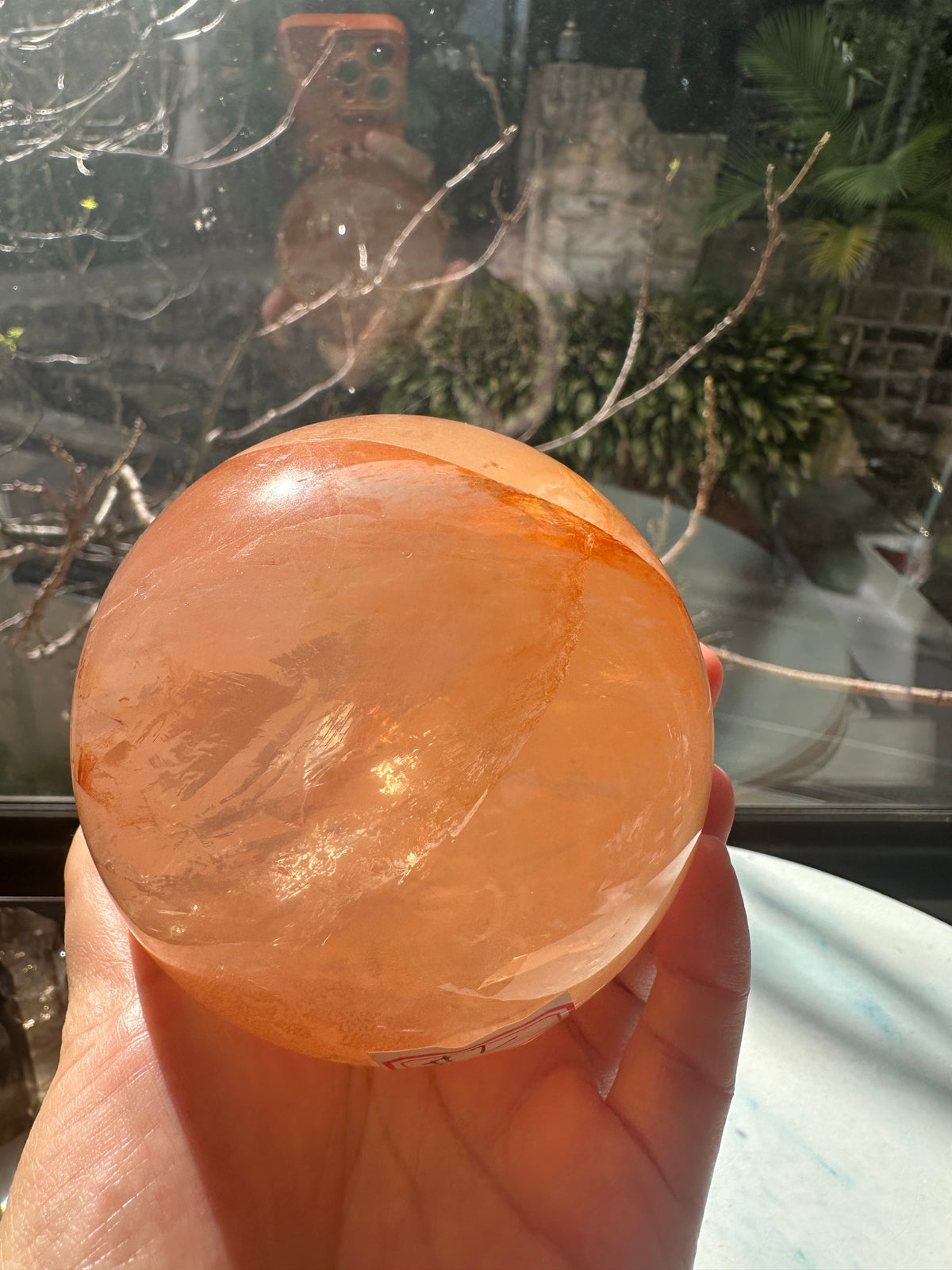 Fire Quartz sphere #2 showing red hematite inclusions and internal quartz veils, alternate view 17