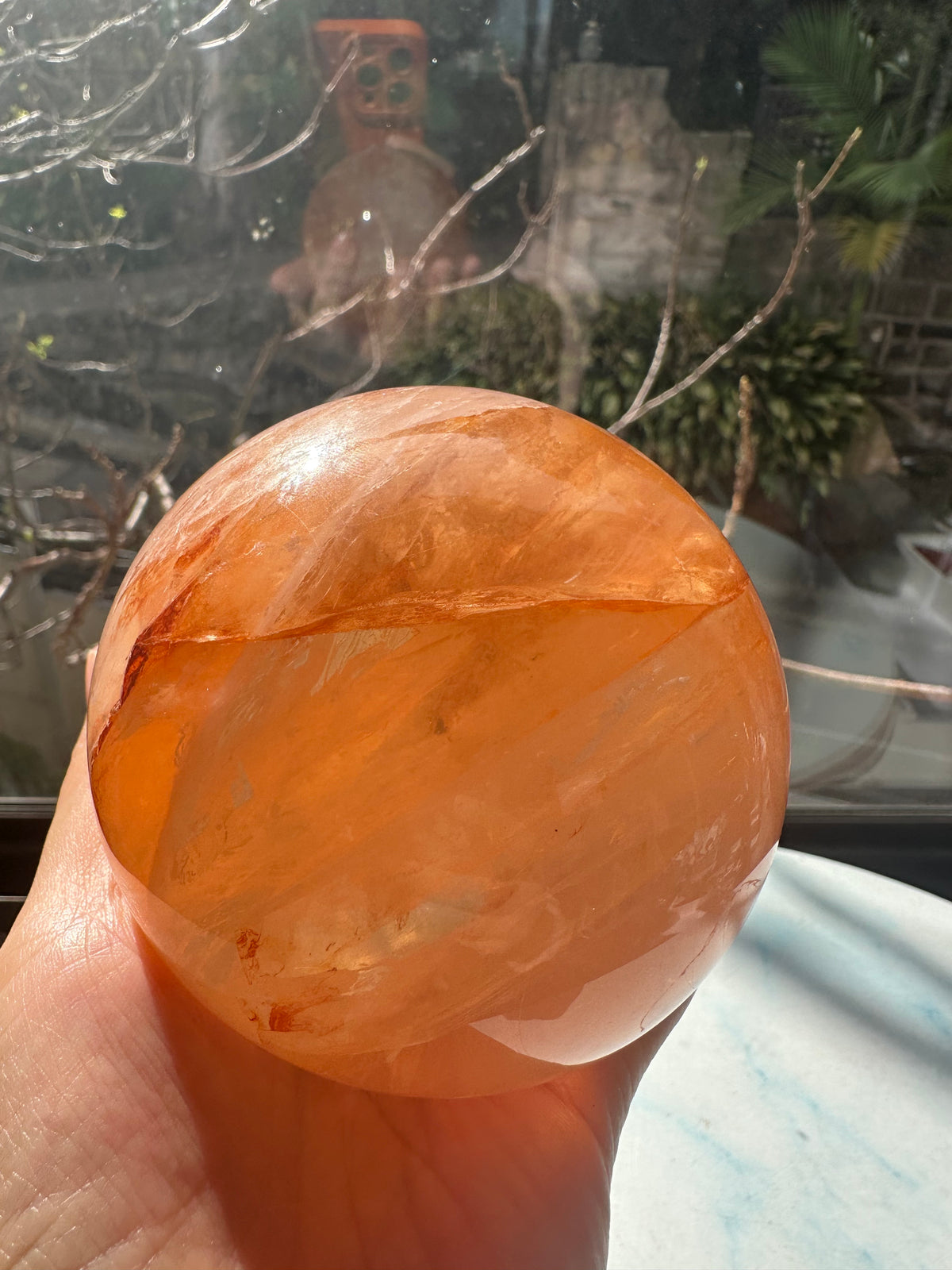 Fire Quartz sphere #2 showing red hematite inclusions and internal quartz veils, alternate view 18