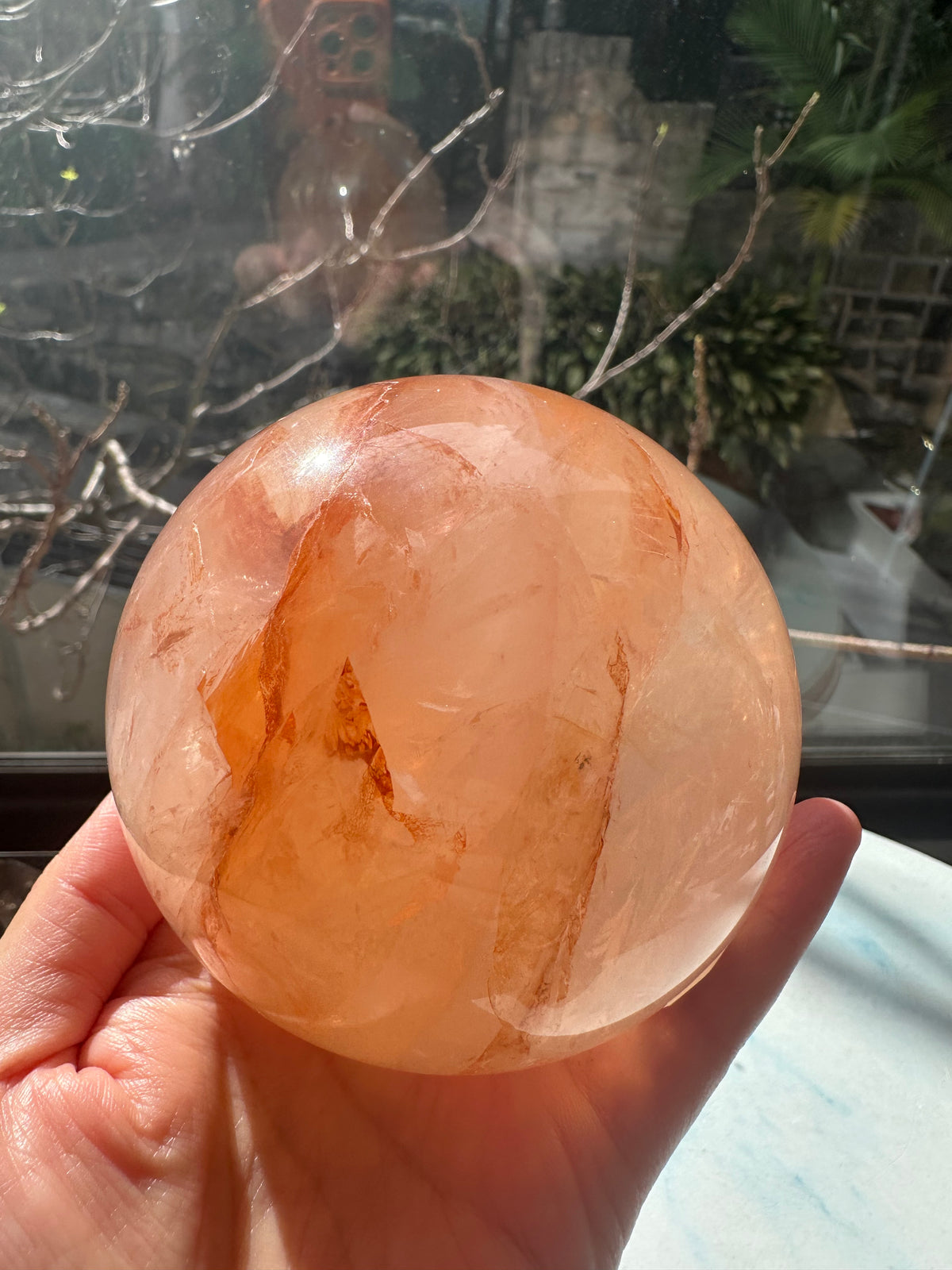 Fire Quartz sphere #2 showing red hematite inclusions and internal quartz veils, alternate view 19