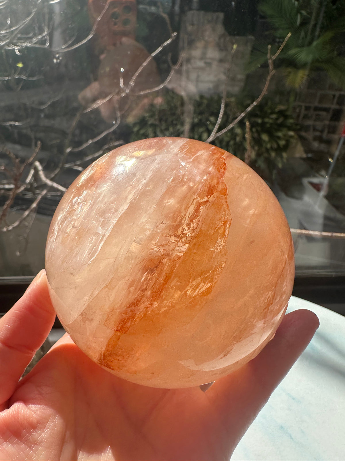 Fire Quartz sphere #2 showing red hematite inclusions and internal quartz veils, alternate view 20