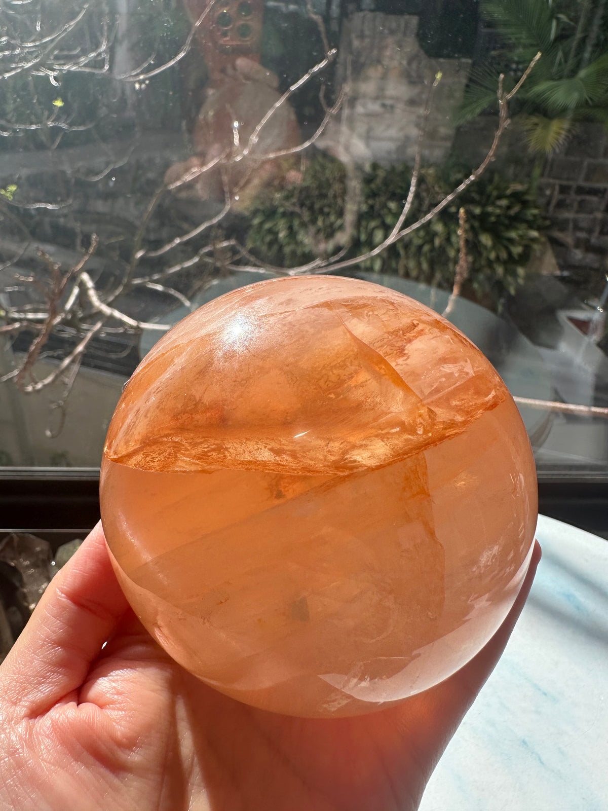 Fire Quartz sphere #2 showing red hematite inclusions and internal quartz veils, alternate view 22
