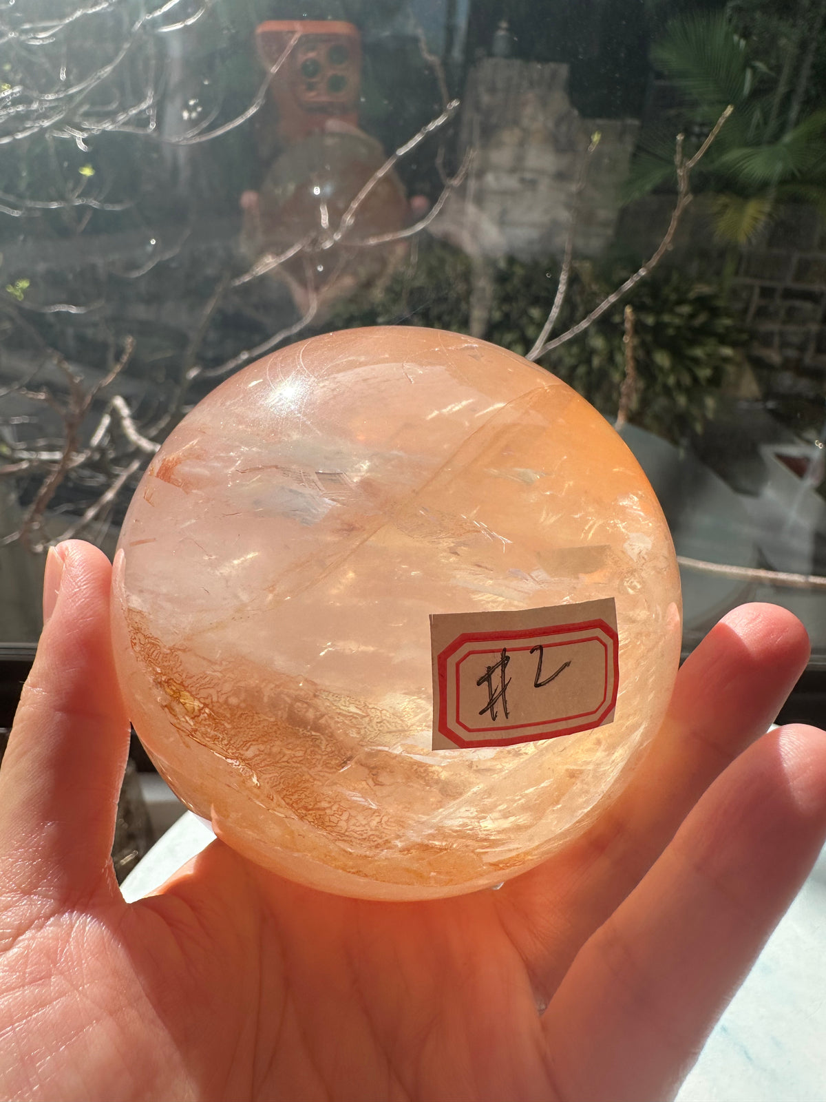 Fire Quartz sphere #2 showing red hematite inclusions and internal quartz veils, alternate view 24