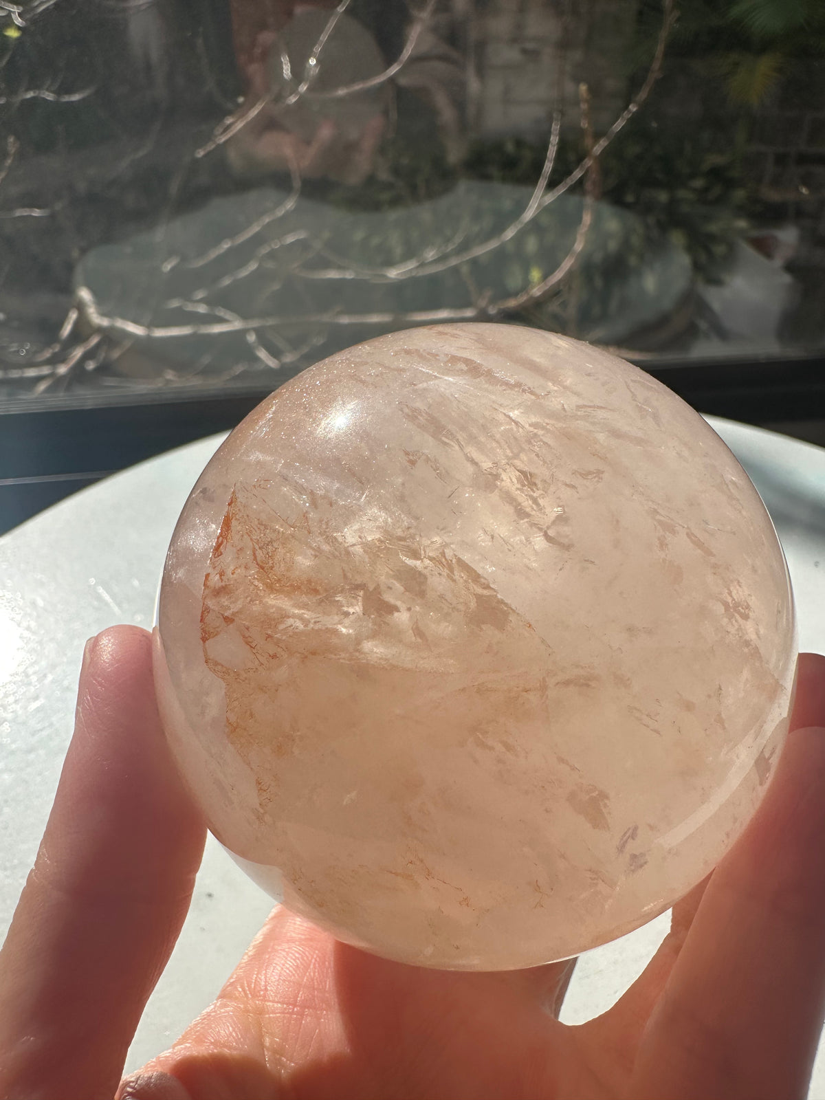 Fire Quartz sphere #3 showing red hematite inclusions and internal quartz veils, alternate view 6