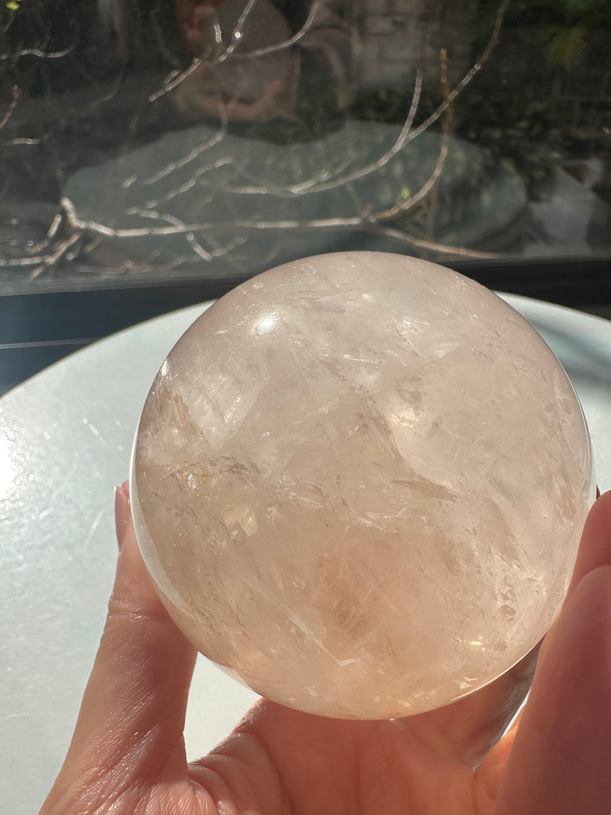Fire Quartz sphere #3 showing red hematite inclusions and internal quartz veils, alternate view 7