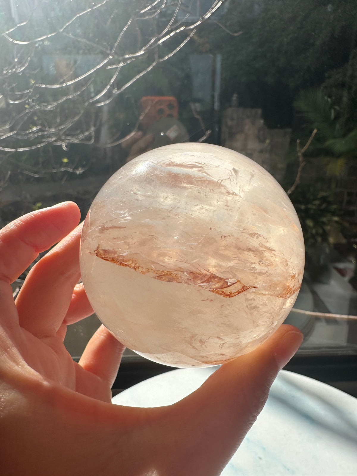 Fire Quartz sphere #3 showing red hematite inclusions and internal quartz veils, alternate view 9