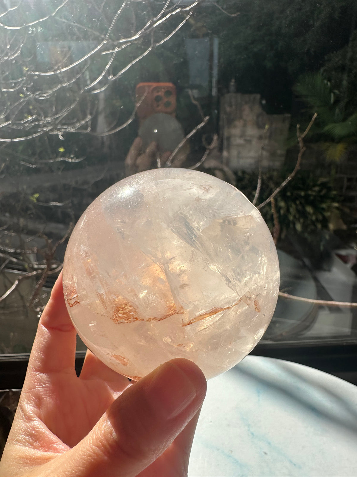 Fire Quartz sphere #3 showing red hematite inclusions and internal quartz veils, alternate view 10