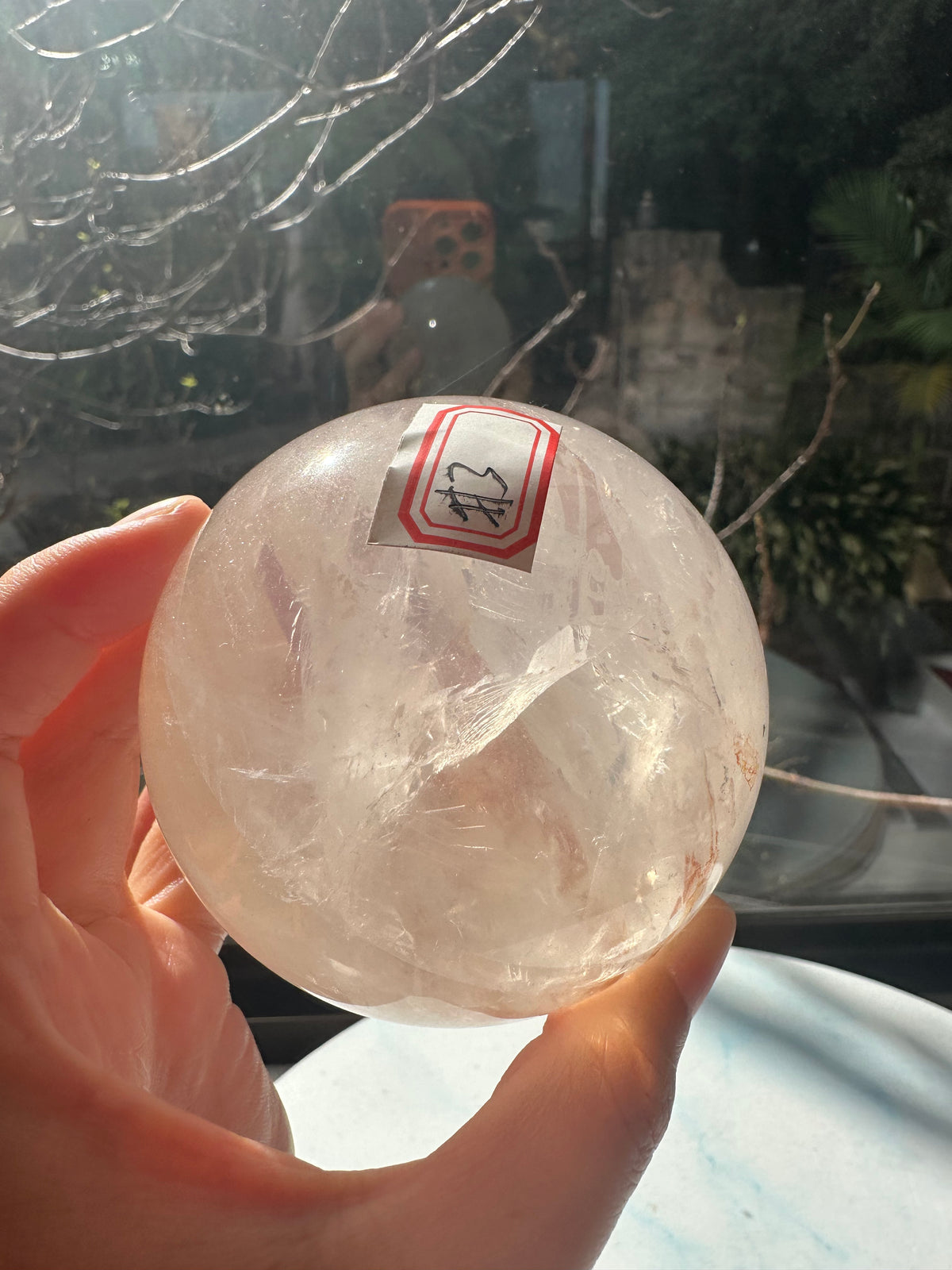 Fire Quartz sphere #3 showing red hematite inclusions and internal quartz veils, alternate view 11