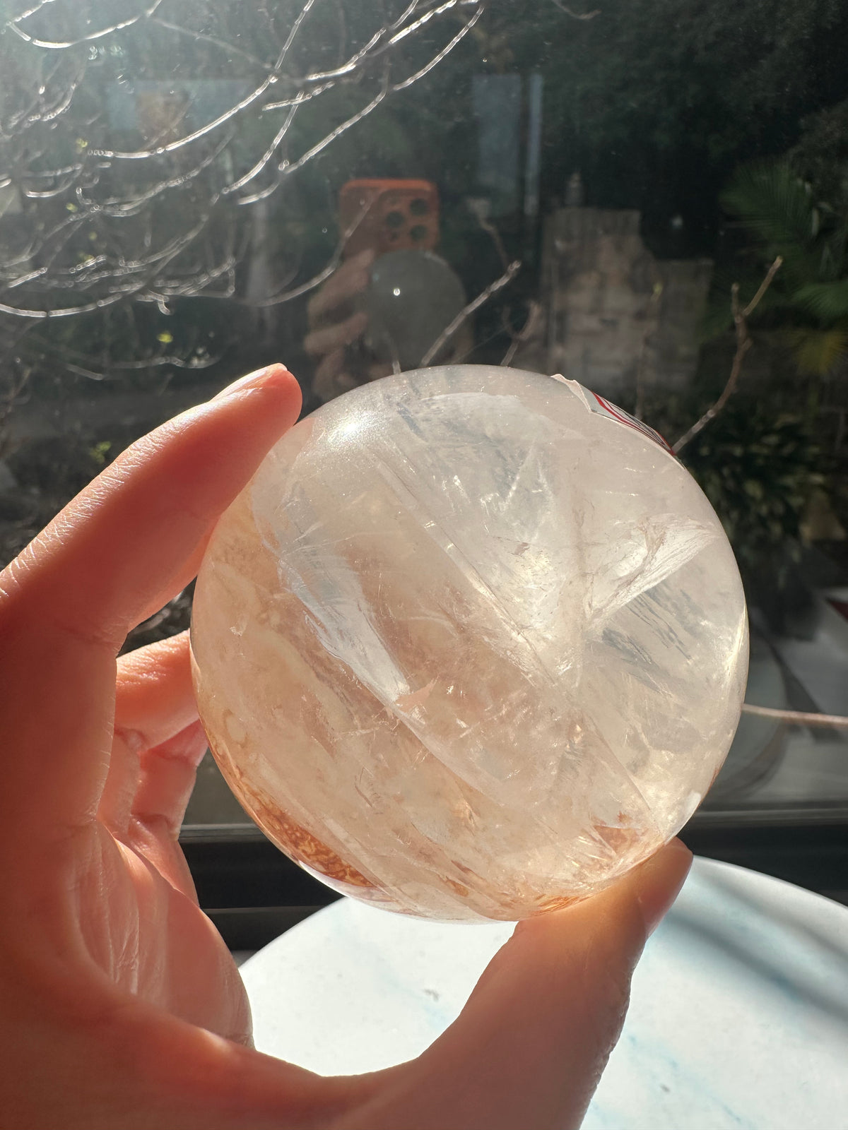 Fire Quartz sphere #3 showing red hematite inclusions and internal quartz veils, alternate view 12