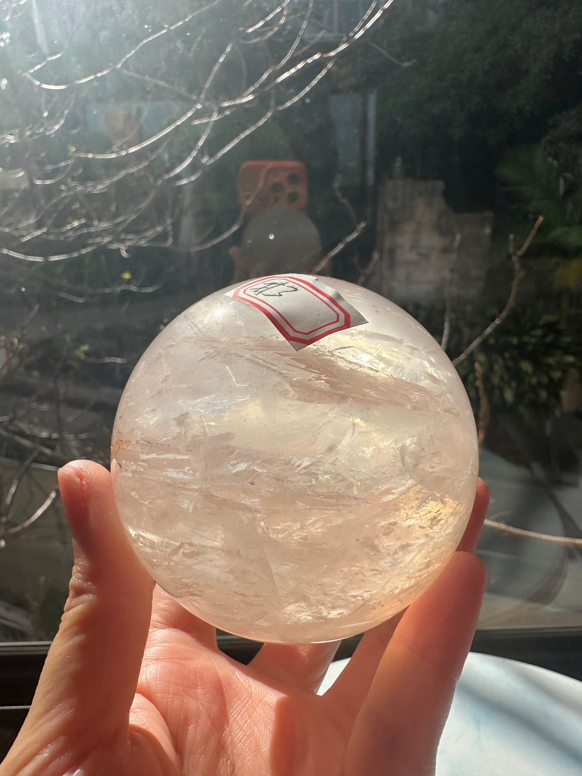 Fire Quartz sphere #3 showing red hematite inclusions and internal quartz veils, alternate view 14