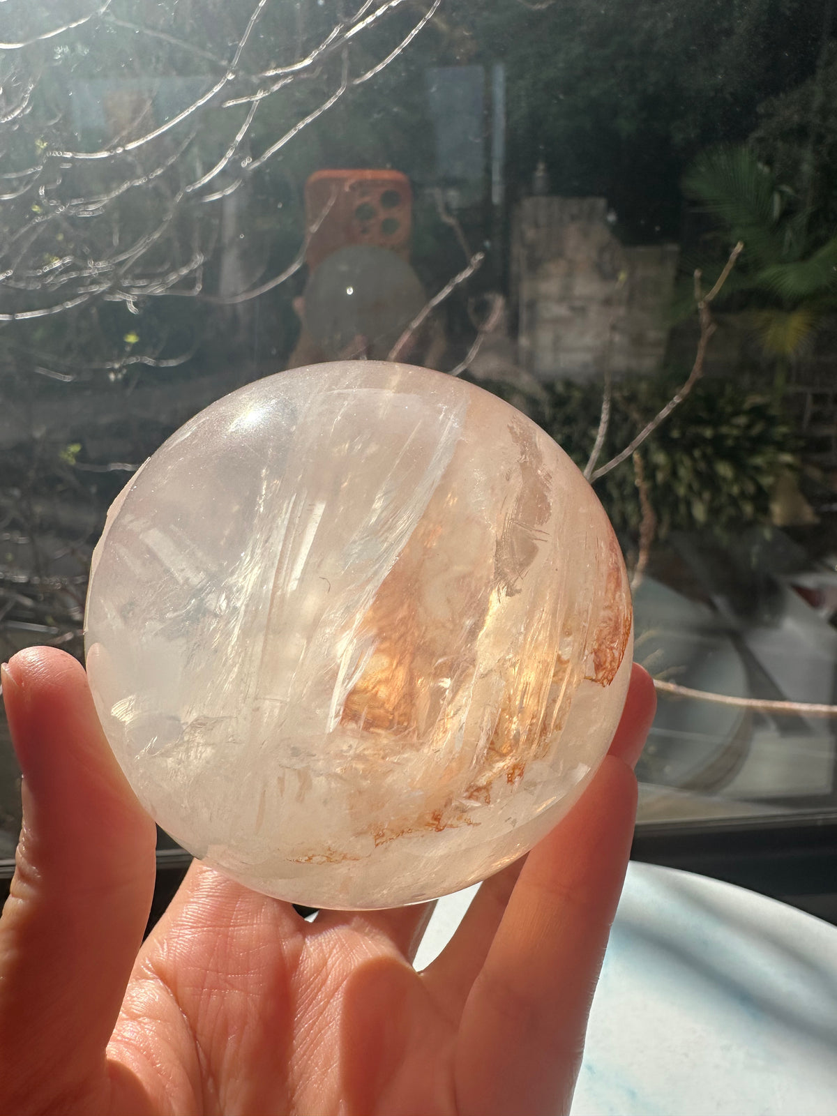 Fire Quartz sphere #3 showing red hematite inclusions and internal quartz veils, alternate view 15
