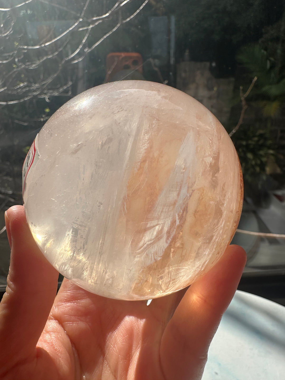 Fire Quartz sphere #3 showing red hematite inclusions and internal quartz veils, alternate view 16
