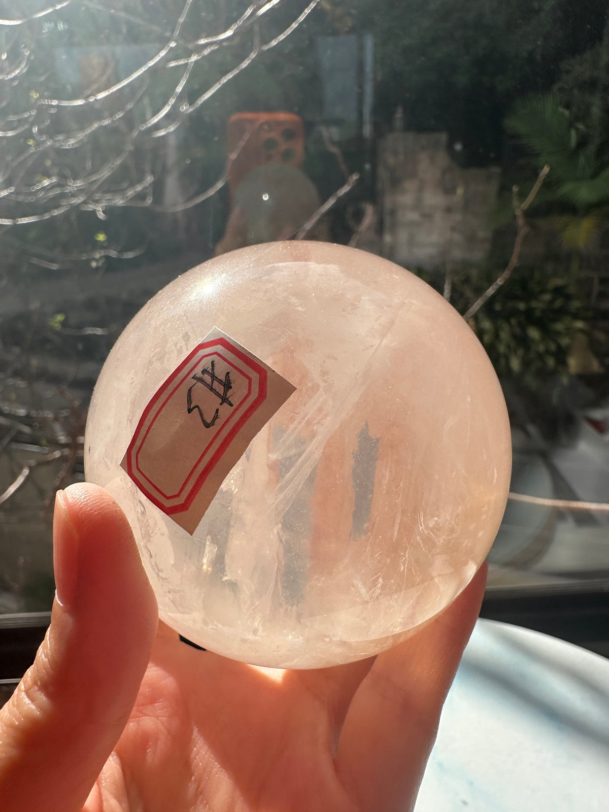 Fire Quartz sphere #3 showing red hematite inclusions and internal quartz veils, alternate view 17