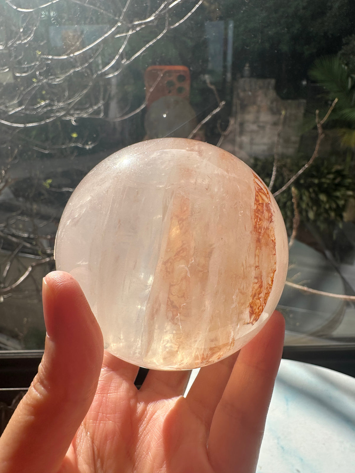 Fire Quartz sphere #3 showing red hematite inclusions and internal quartz veils, alternate view 18