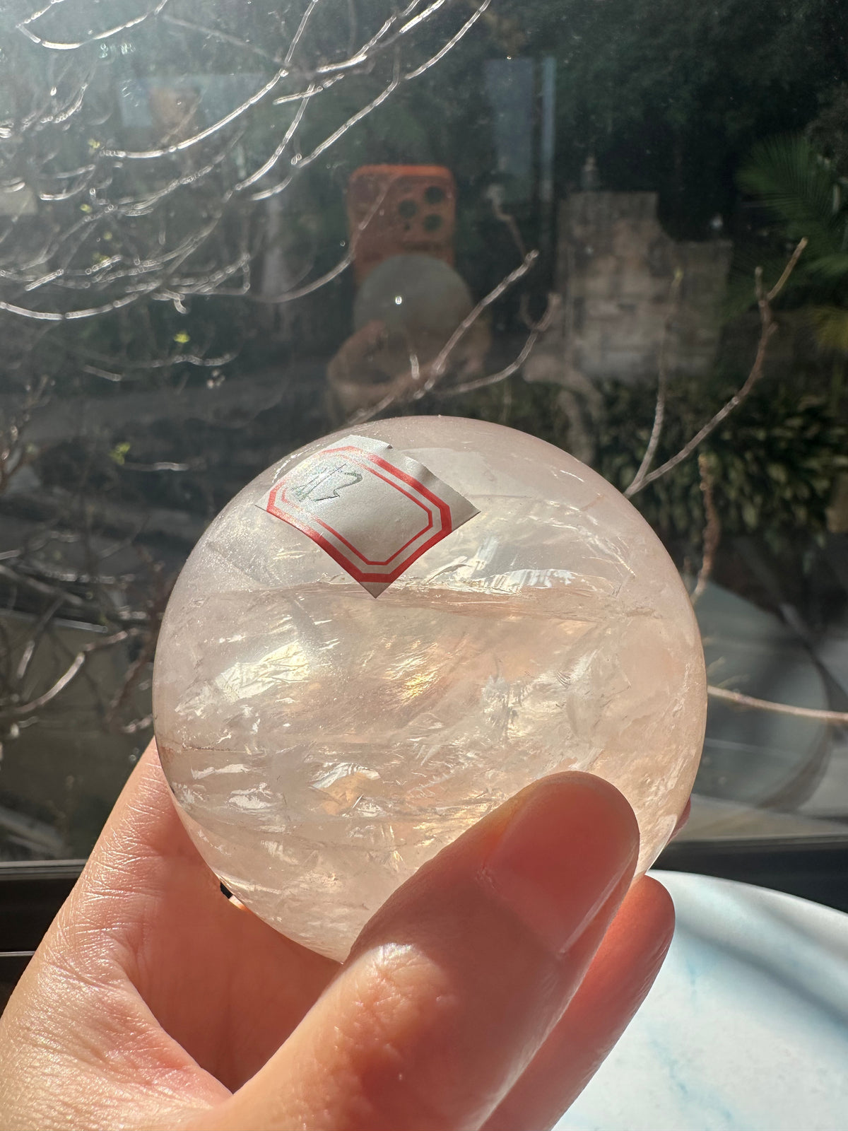 Fire Quartz sphere #3 showing red hematite inclusions and internal quartz veils, alternate view 20