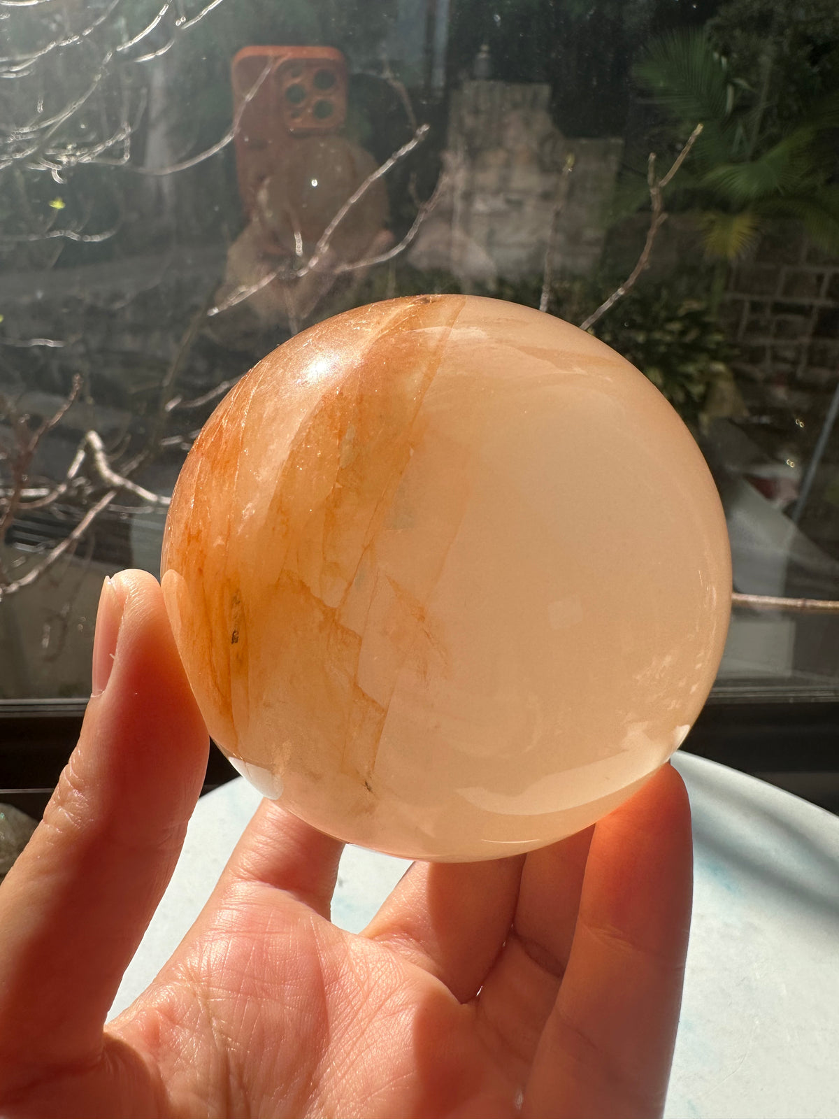 Fire Quartz sphere #4 showing red hematite inclusions and internal quartz veils, alternate view 6