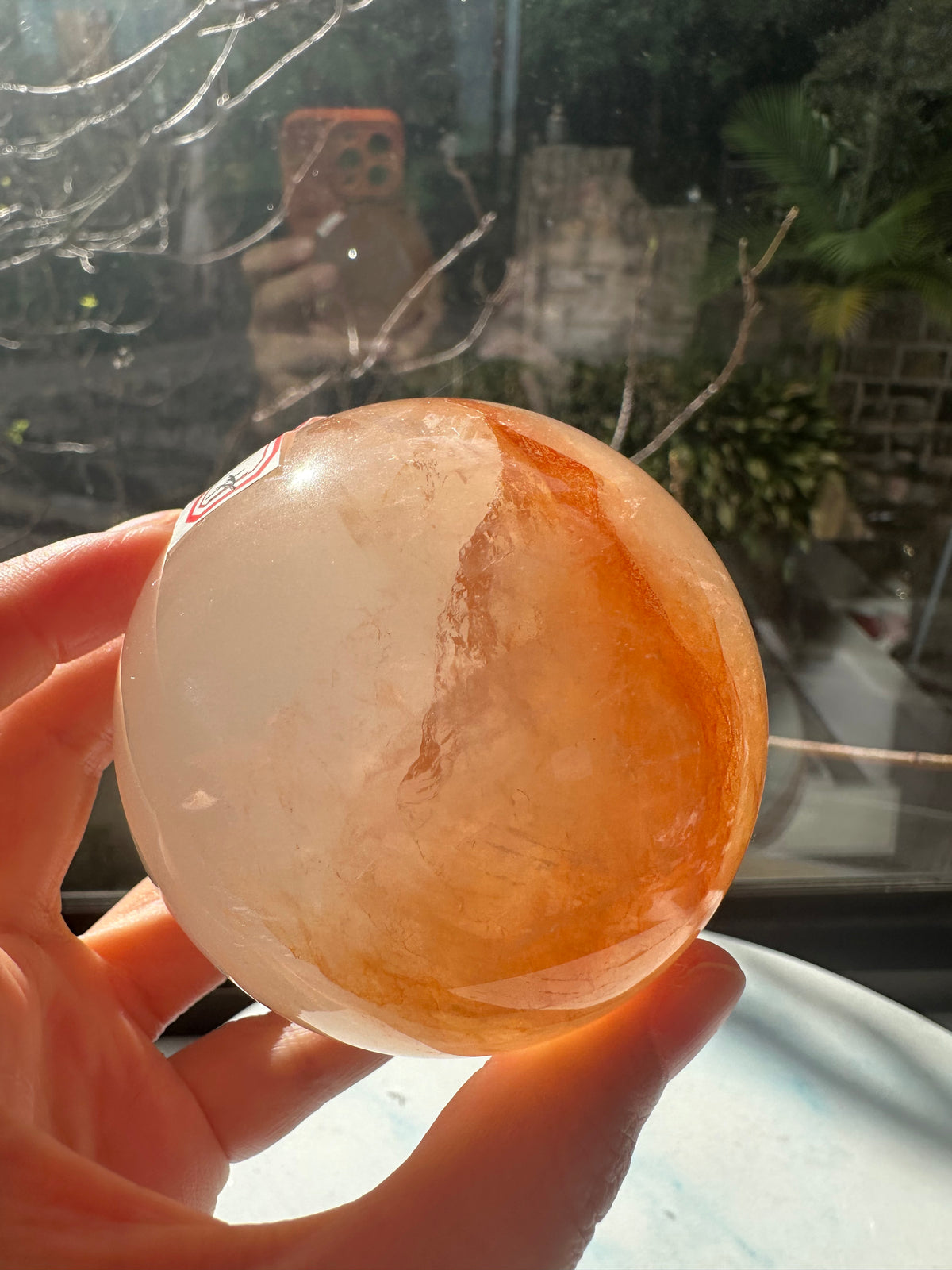 Fire Quartz sphere #4 showing red hematite inclusions and internal quartz veils, alternate view 7