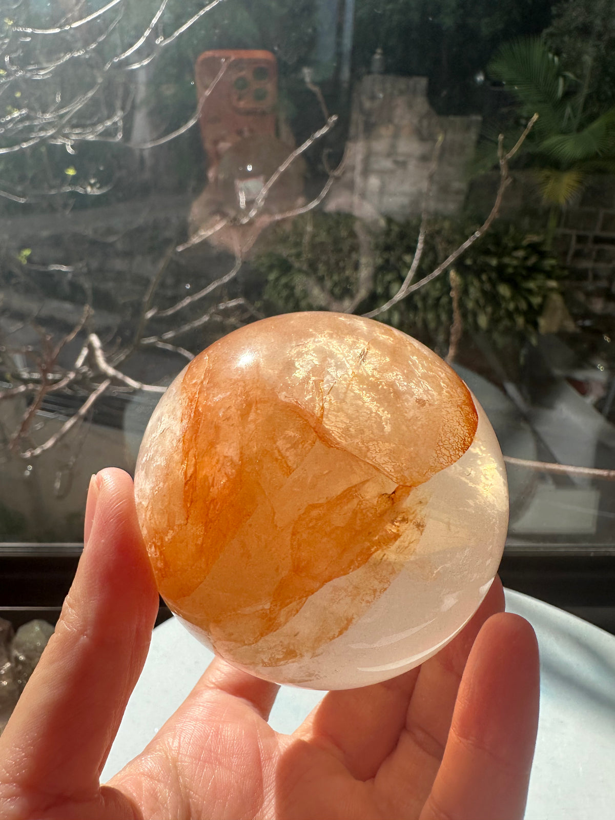 Fire Quartz sphere #4 showing red hematite inclusions and internal quartz veils, alternate view 9