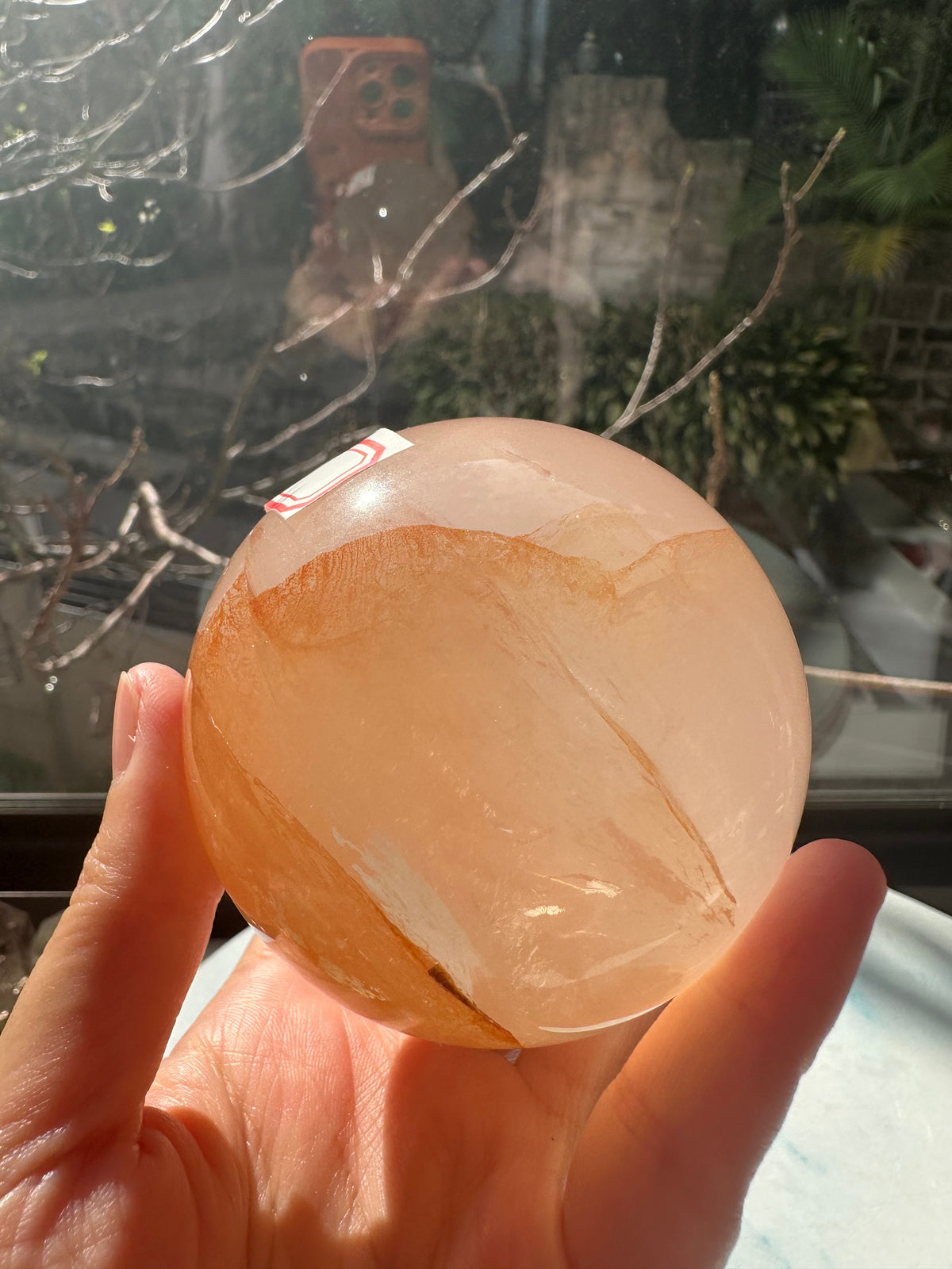 Fire Quartz sphere #4 showing red hematite inclusions and internal quartz veils, alternate view 11