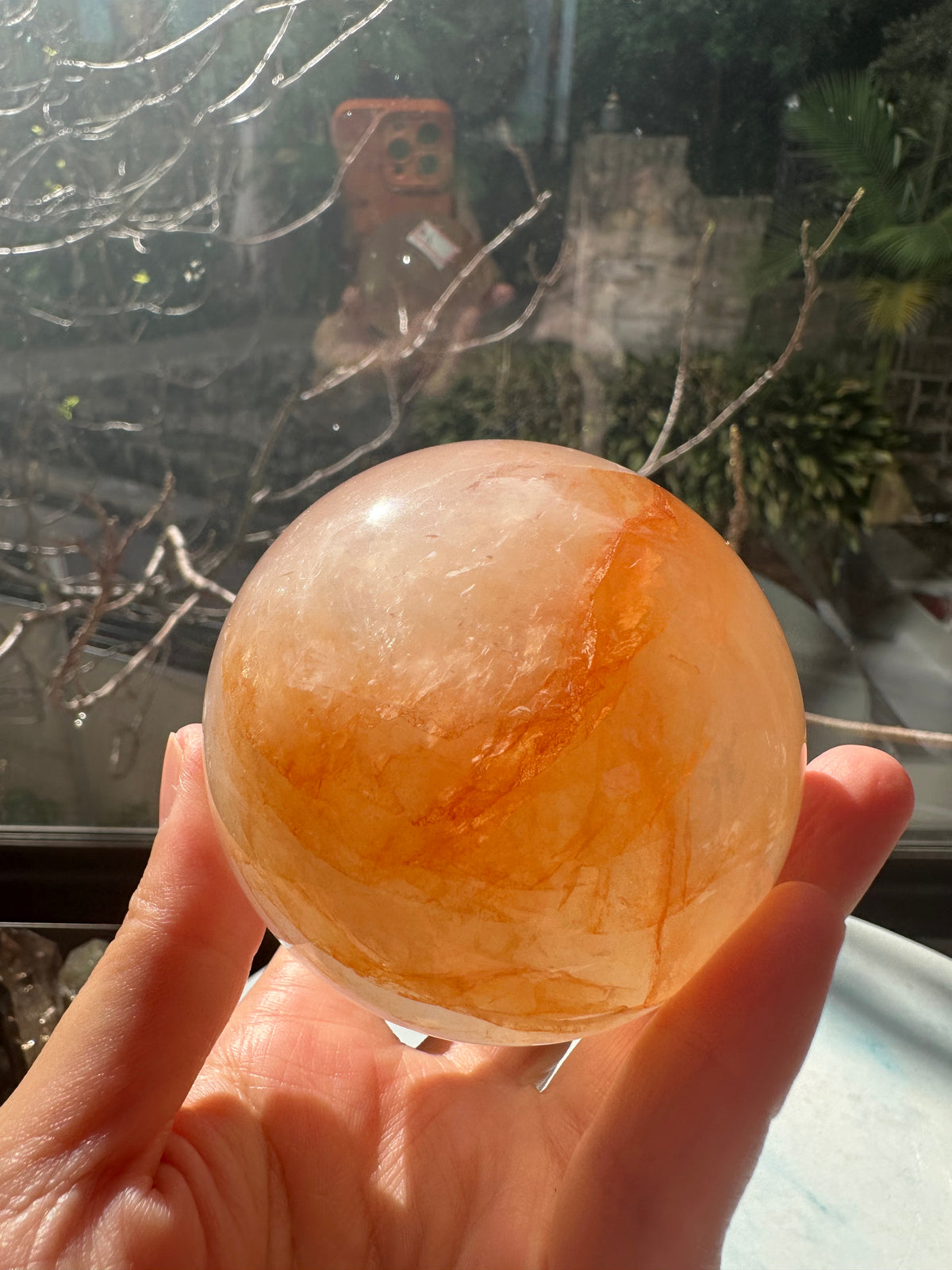 Fire Quartz sphere #4 showing red hematite inclusions and internal quartz veils, alternate view 12