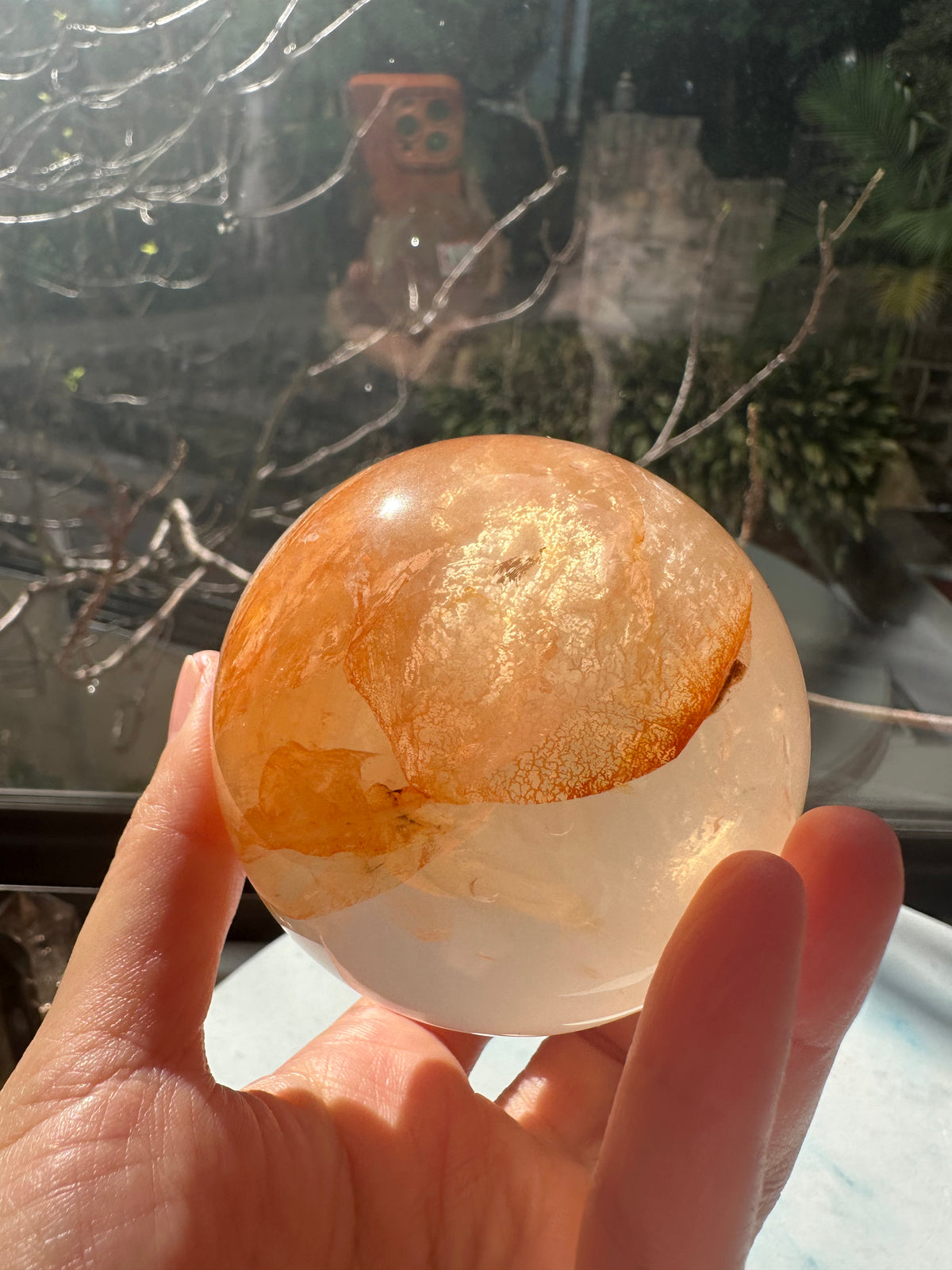 Fire Quartz sphere #4 showing red hematite inclusions and internal quartz veils, alternate view 13