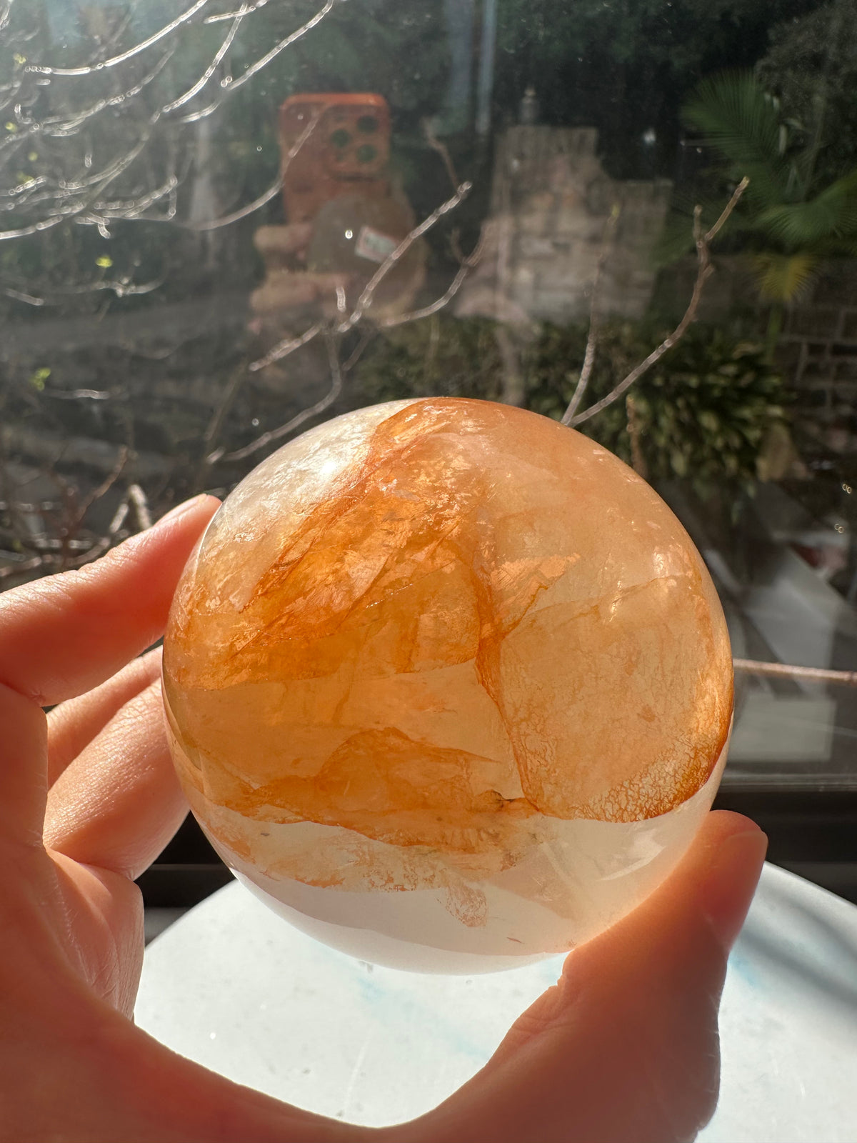 Fire Quartz sphere #4 showing red hematite inclusions and internal quartz veils, alternate view 14